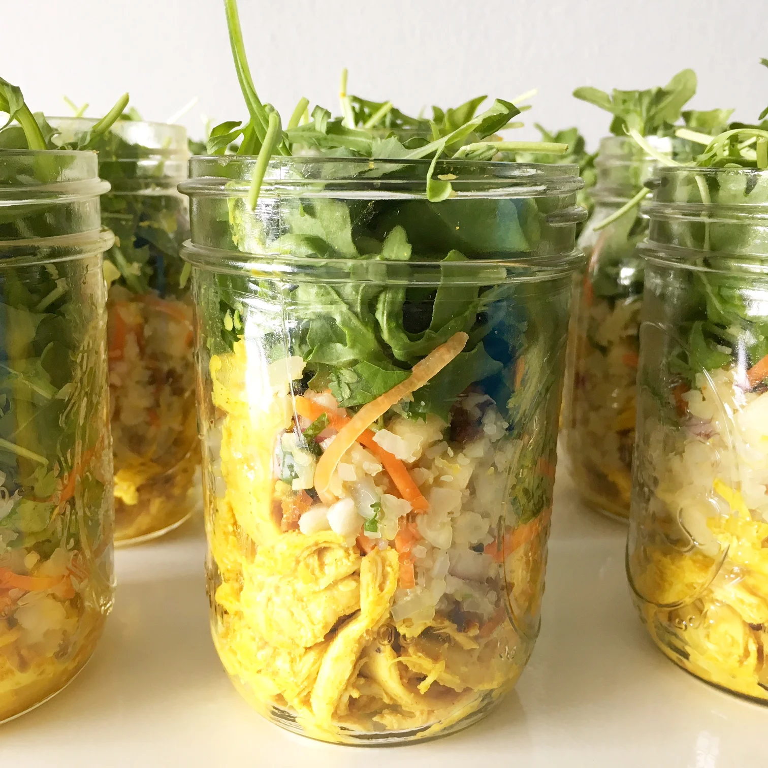 Anti-Inflammatory Turmeric Chicken Bowl with Cauliflower 'Cous Cous' & Arugula!