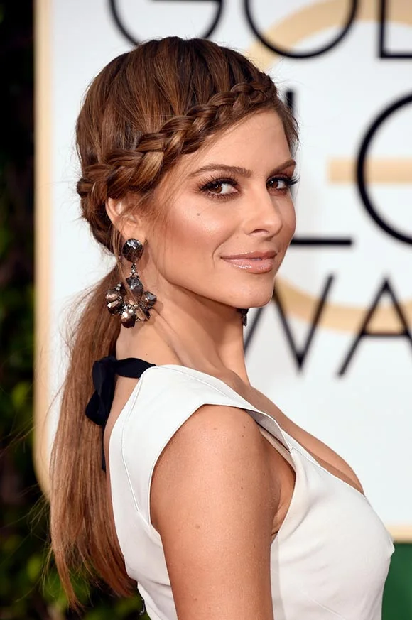 Braids are such a hot item again this year. Dress up your hairstyle by adding a fun party braid in the "bang" area. Try using a light pomade to control all of those stubborn baby hairs. Braids are perfect for all parties. Bring on the braid!
