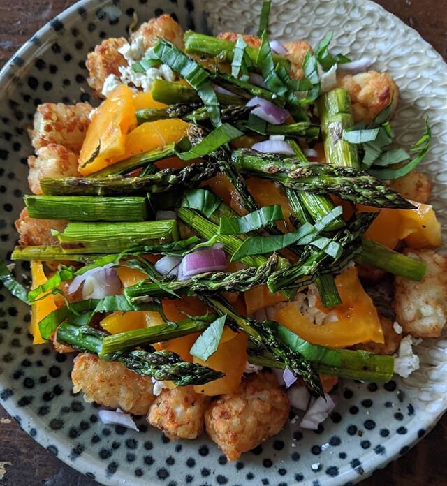 My attempt to nutritionally enhance some tots:  add roasted asparagus, red onion, tomato, fresh basil and a little bit of @amazingacres goat cheese.  #gimmeyourtots #justaddveggies