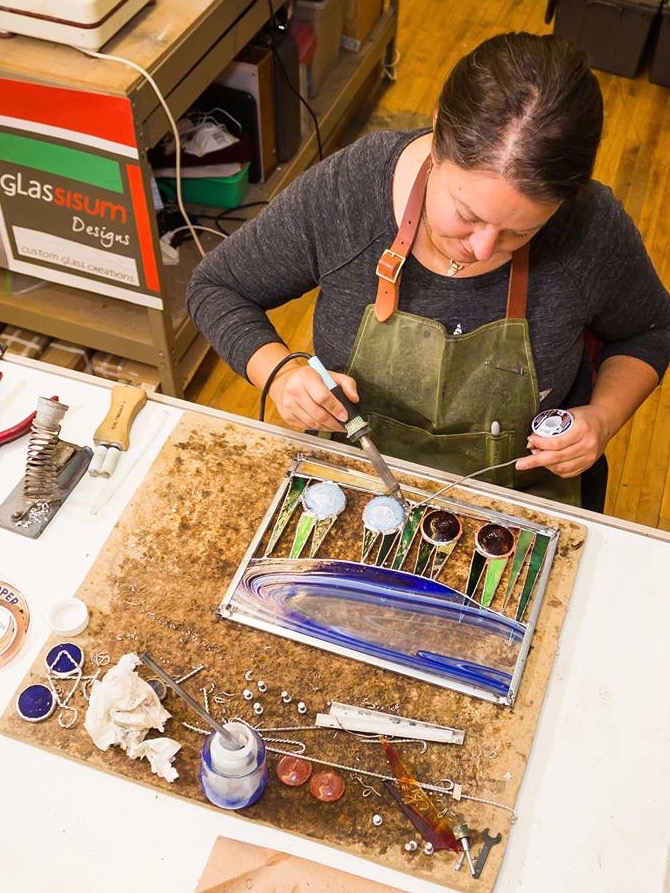 Katie Sisum working in her studio.