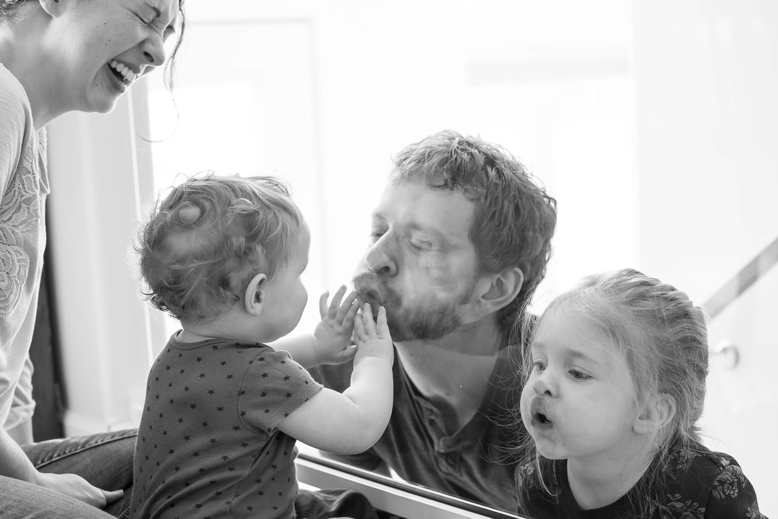Evan & Heidi have this plexiglass banister that the kids just LOVE to fingerprint. If I'm not mistaken, Daddy is the instigator! You'll have to ask them if you want to see some of the outtakes...