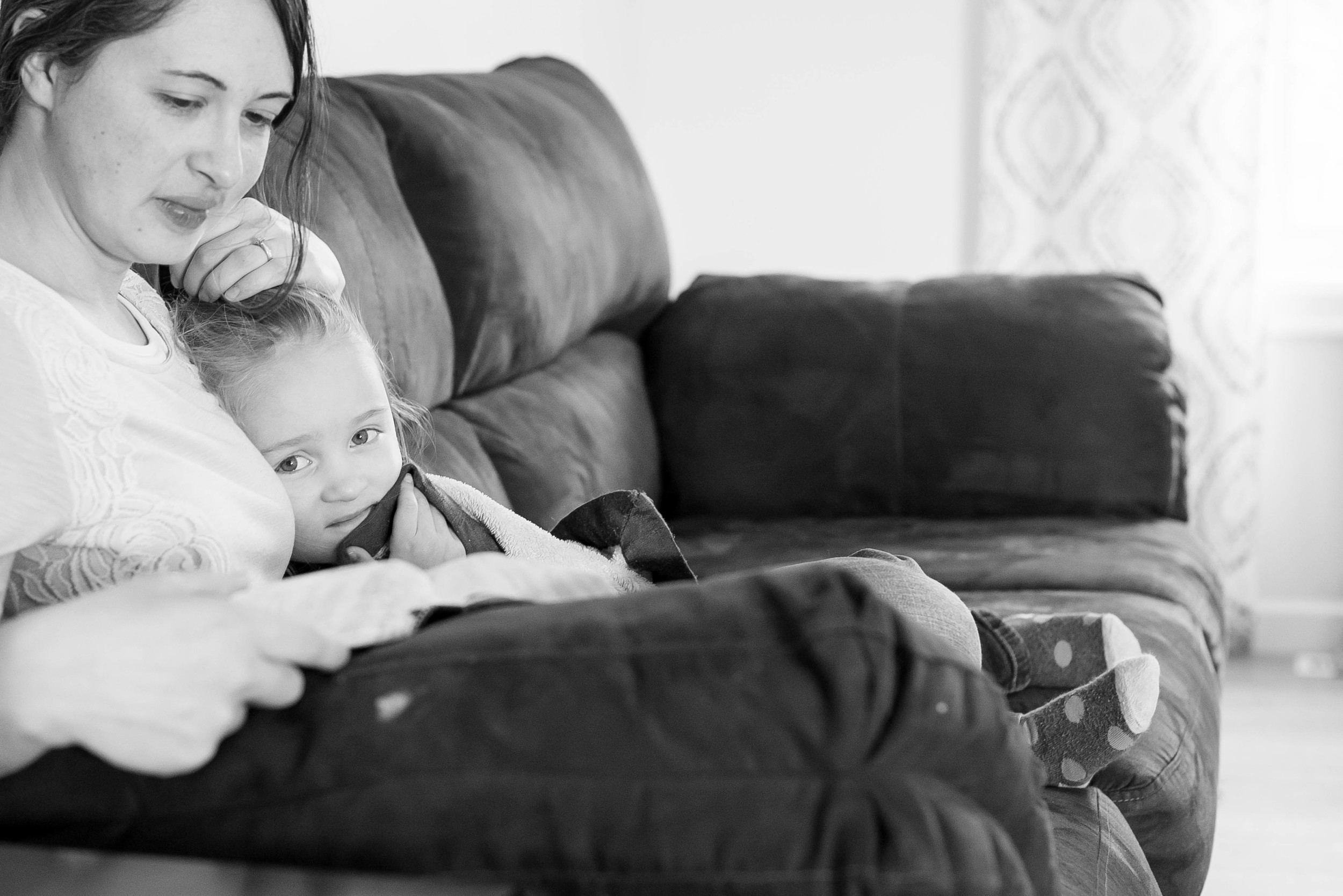 This is how Heidi's morning begins... she does some reading, and Ava cuddles with her on the couch right after waking up.