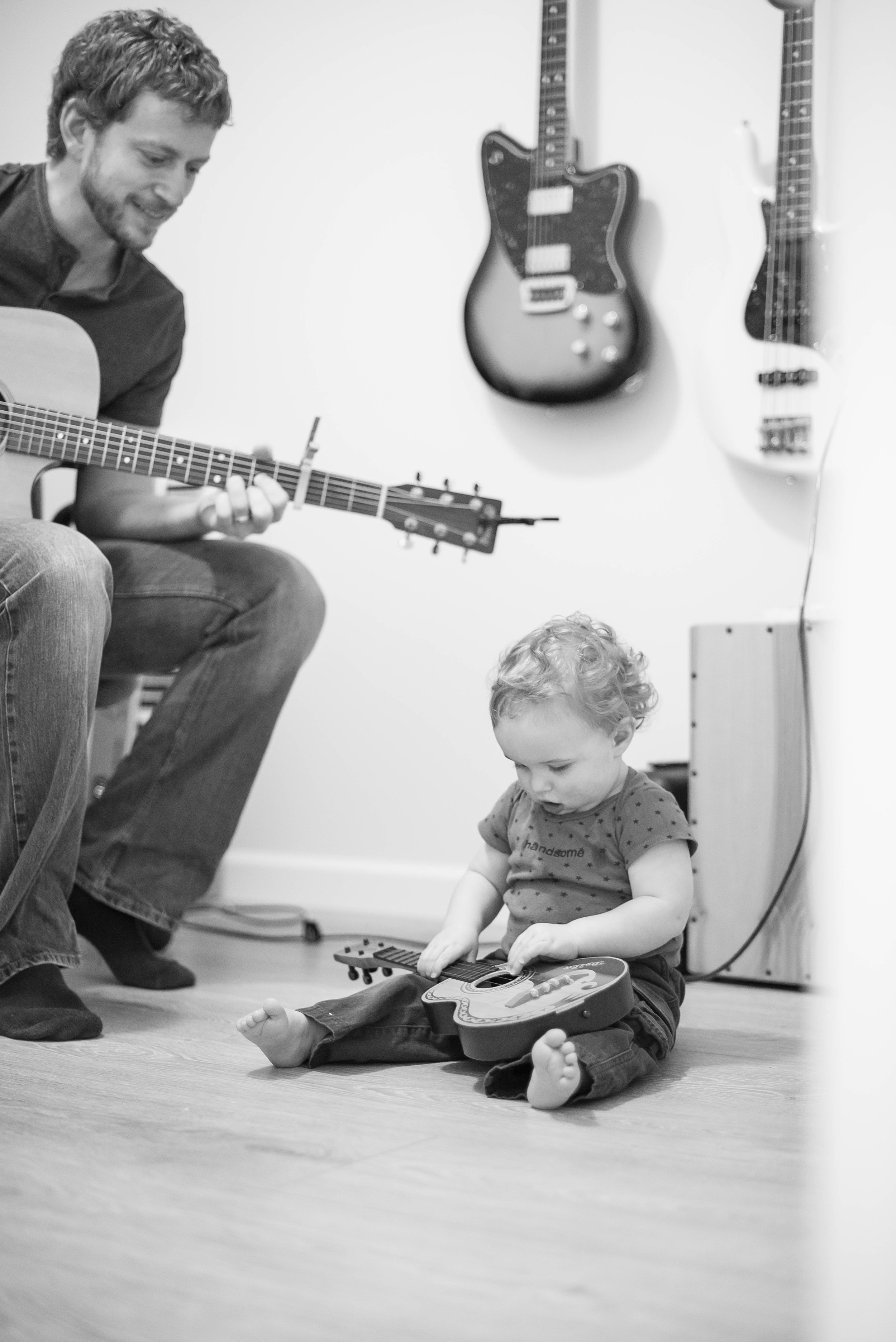 Evan & Heidi are both quite musical, and I get the feeling they're going to pass that talent off to their kiddos. Here, Myles learns how to hold the guitar left handed... haha!