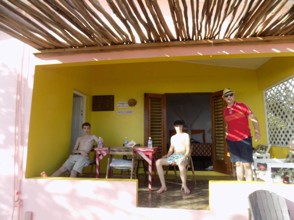 My fellas on the porch of our pink and yellow cottage (Jack Spratt).