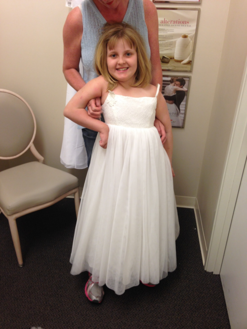 Wearing her flower girl dress for her big sister's wedding in 2015