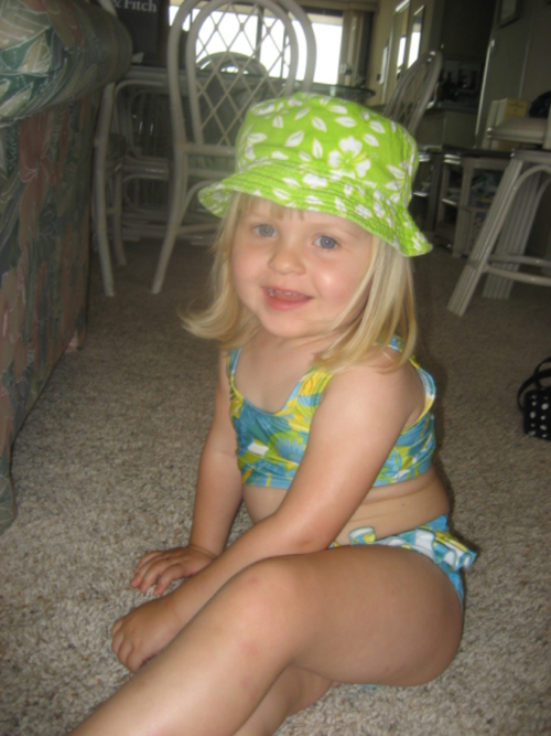 Posing at the beach, age 3