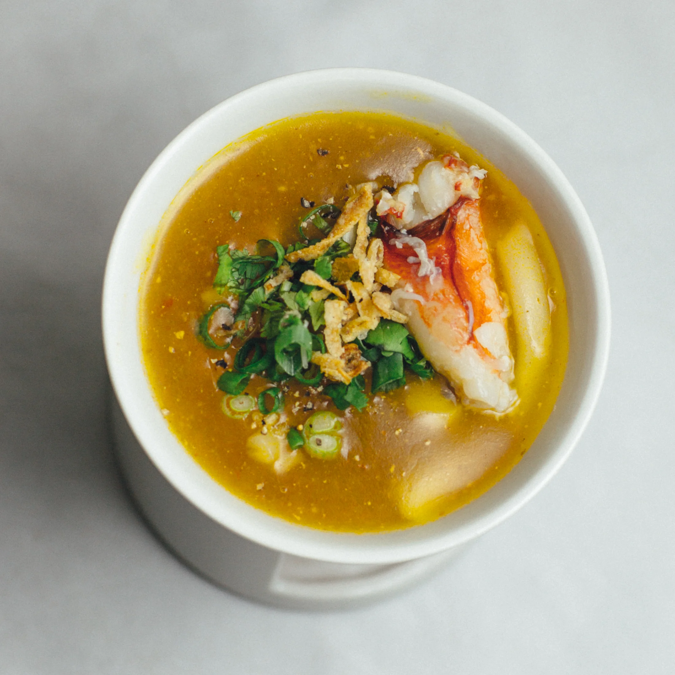 Our multi-course tasting menu focuses on the extraordinary agricultural bounty of Vietnam and on the centuries-old culinary traditions that have taken root here. 