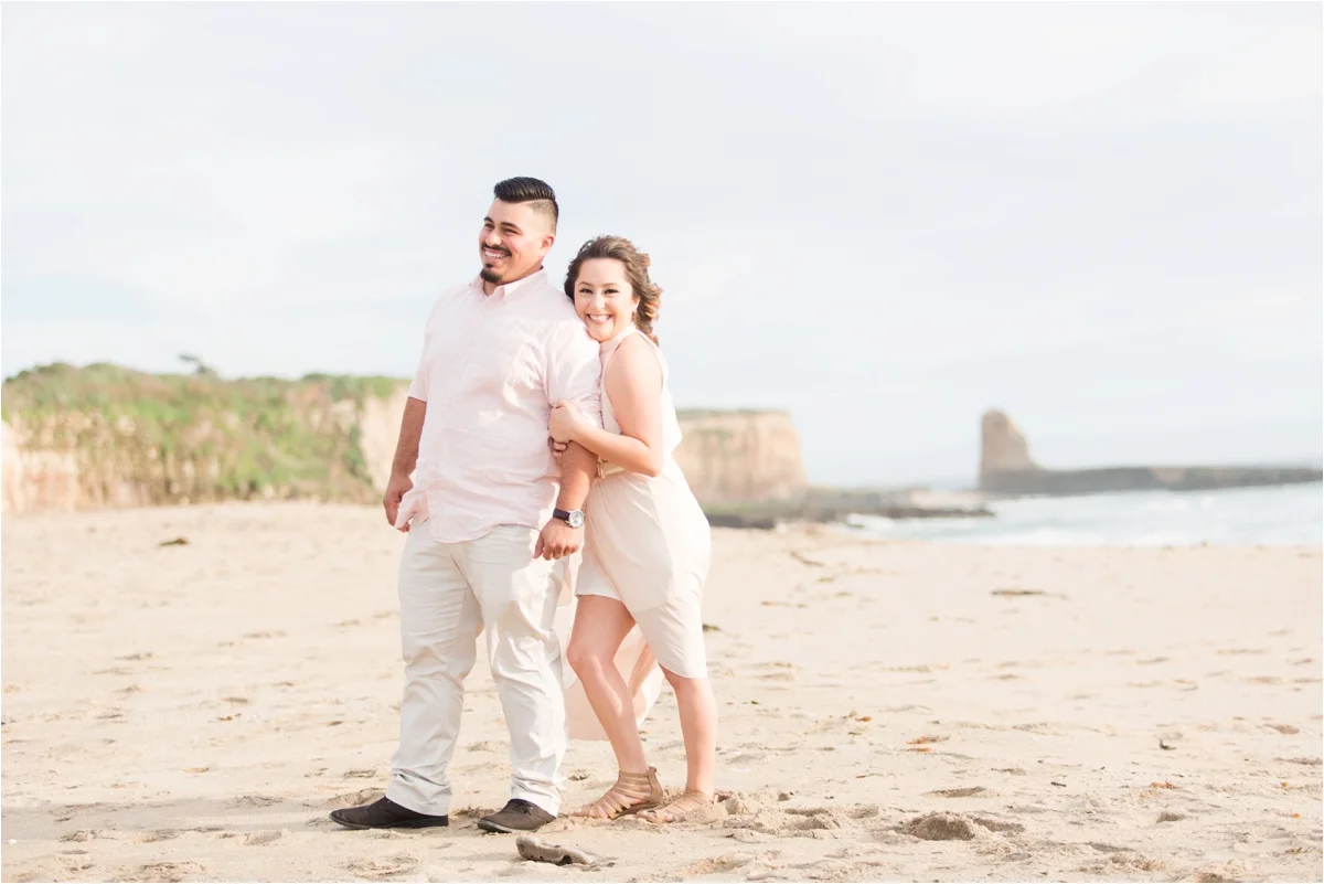 Engagement photo shoot at Four Mile Beach in Santa Cruz, CA. Pictures by Briana Calderon Photography based in the San Francisco Bay Area in California.