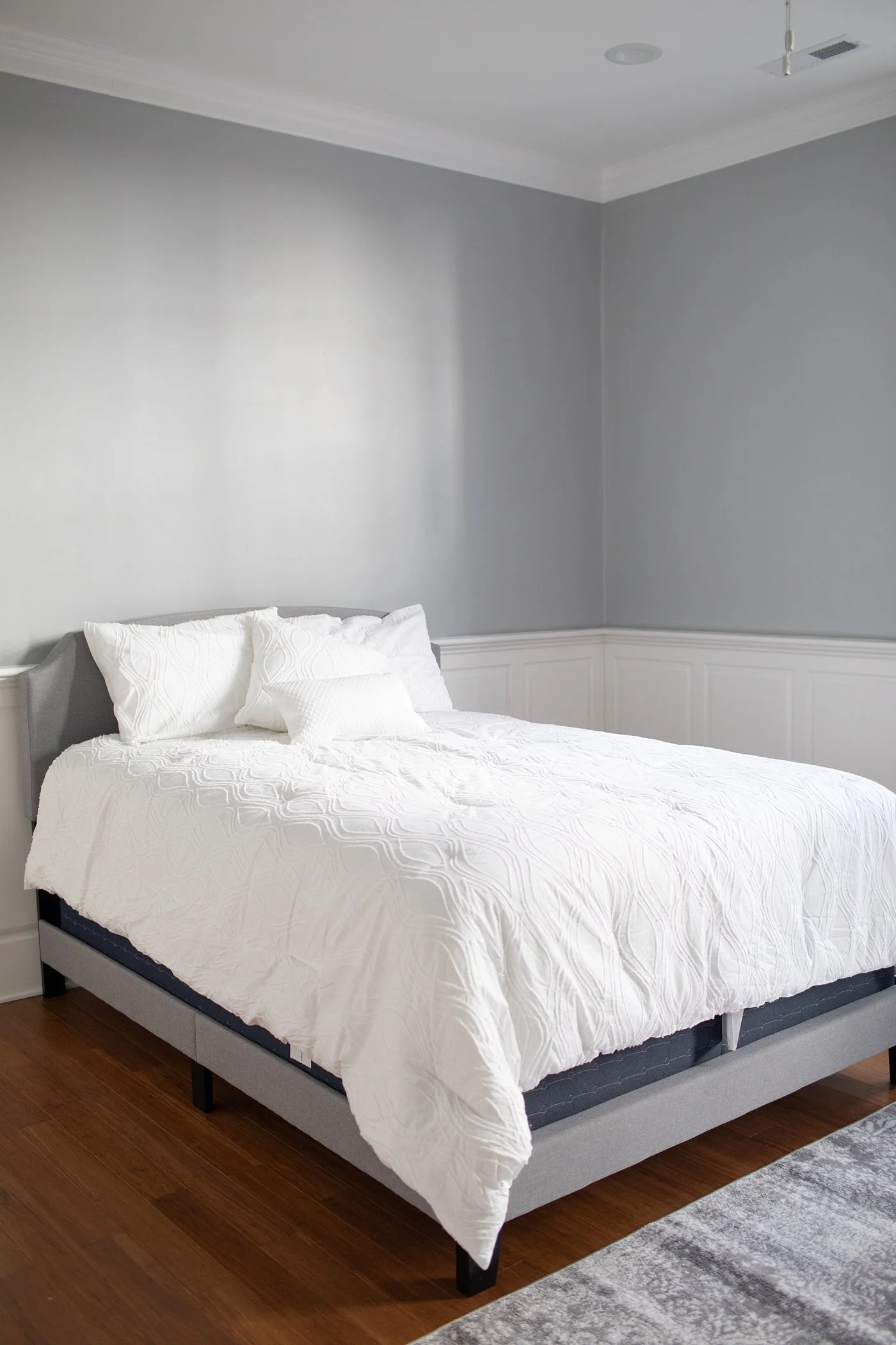 This is the master bedroom. After putting the bed frame together, I realized we would need a boxspring cover! If anyone wants to come help me wrestle a queen sized box spring into this cover, let me know! ;)