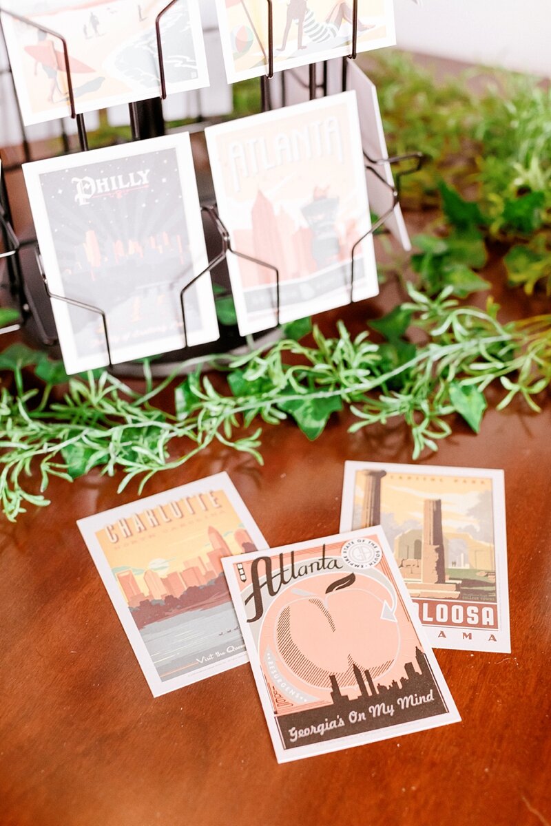  Our guestbook idea came from  Jess &amp; Michael’s wedding ! We had a rack of beautiful postcards that our guests wrote us, then dropped in the little mailbox. It’s so fun to go back and read them AND see which postcards everyone chose! 