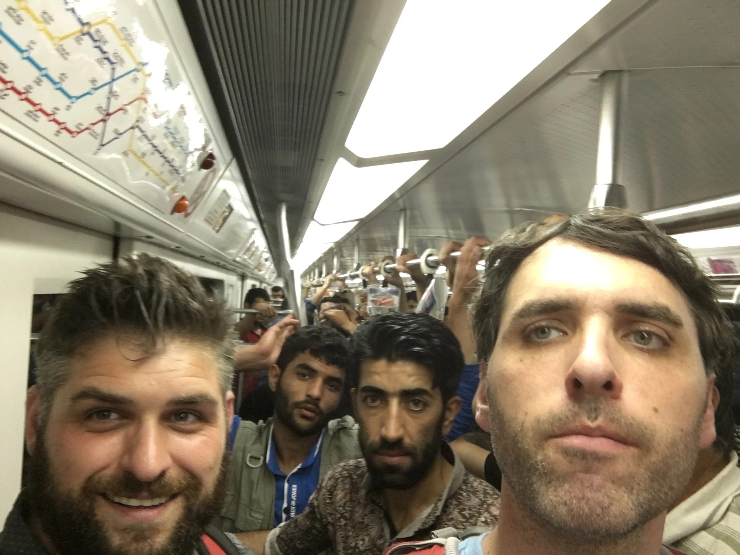 My brother and me riding the subway in Tehran