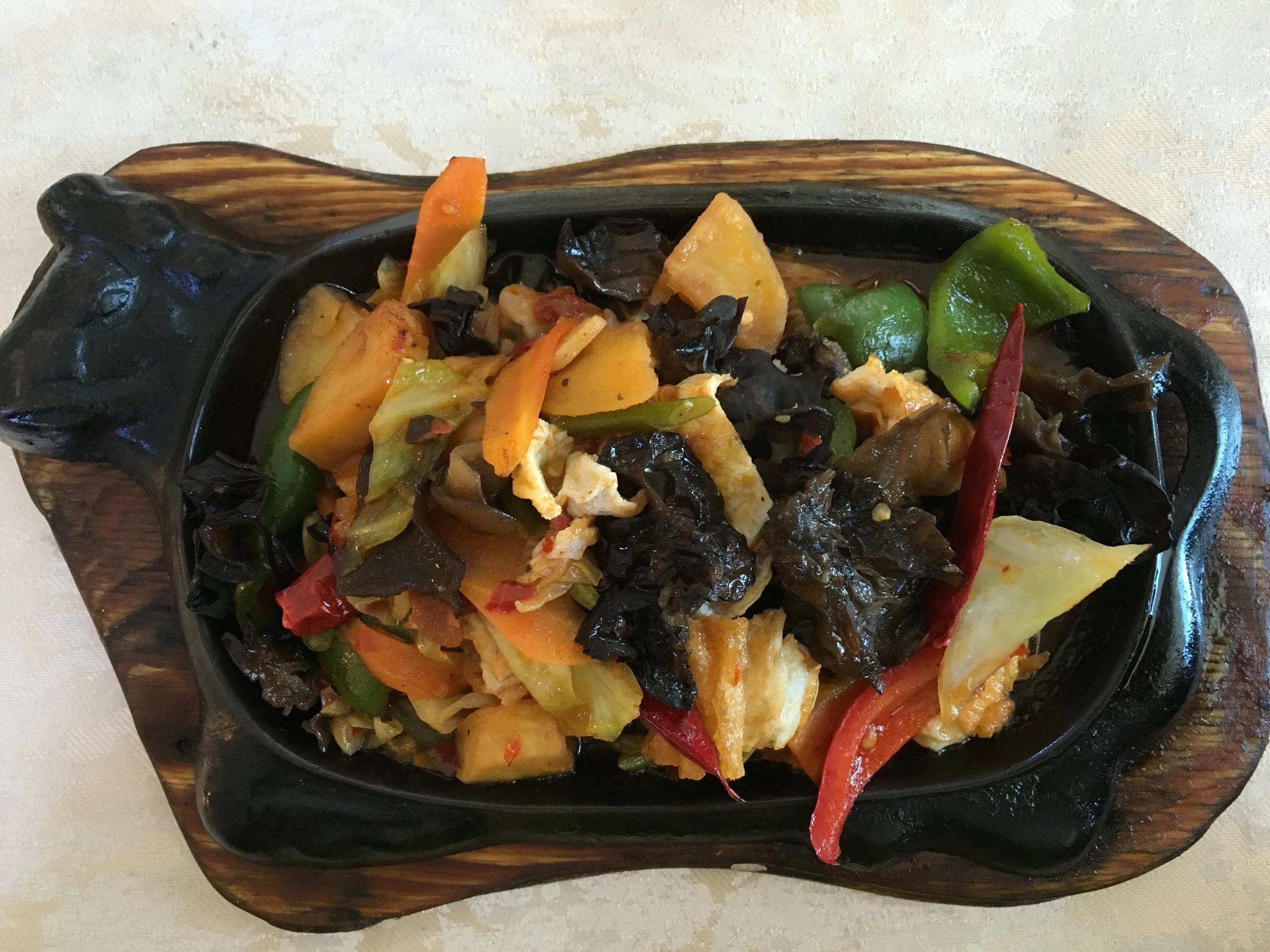Delicious vegetarian dish of sizzling peppers and mushrooms