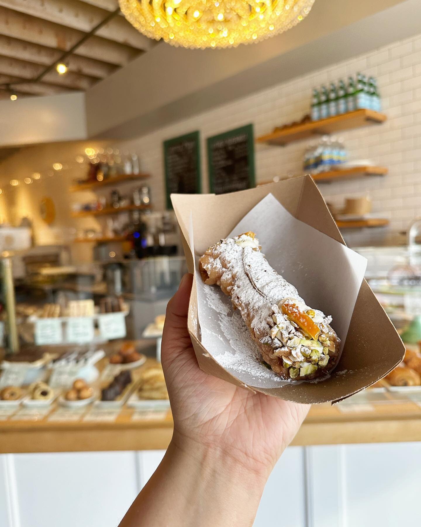 Hey Bakeshop friends! We heard you, today our cannoli are available at the shop. Our bubbly tender shells are filled with a housemade ricotta filling speckled with mini chocolate chips and finished with toasted pistachios, candies orange peel and ple