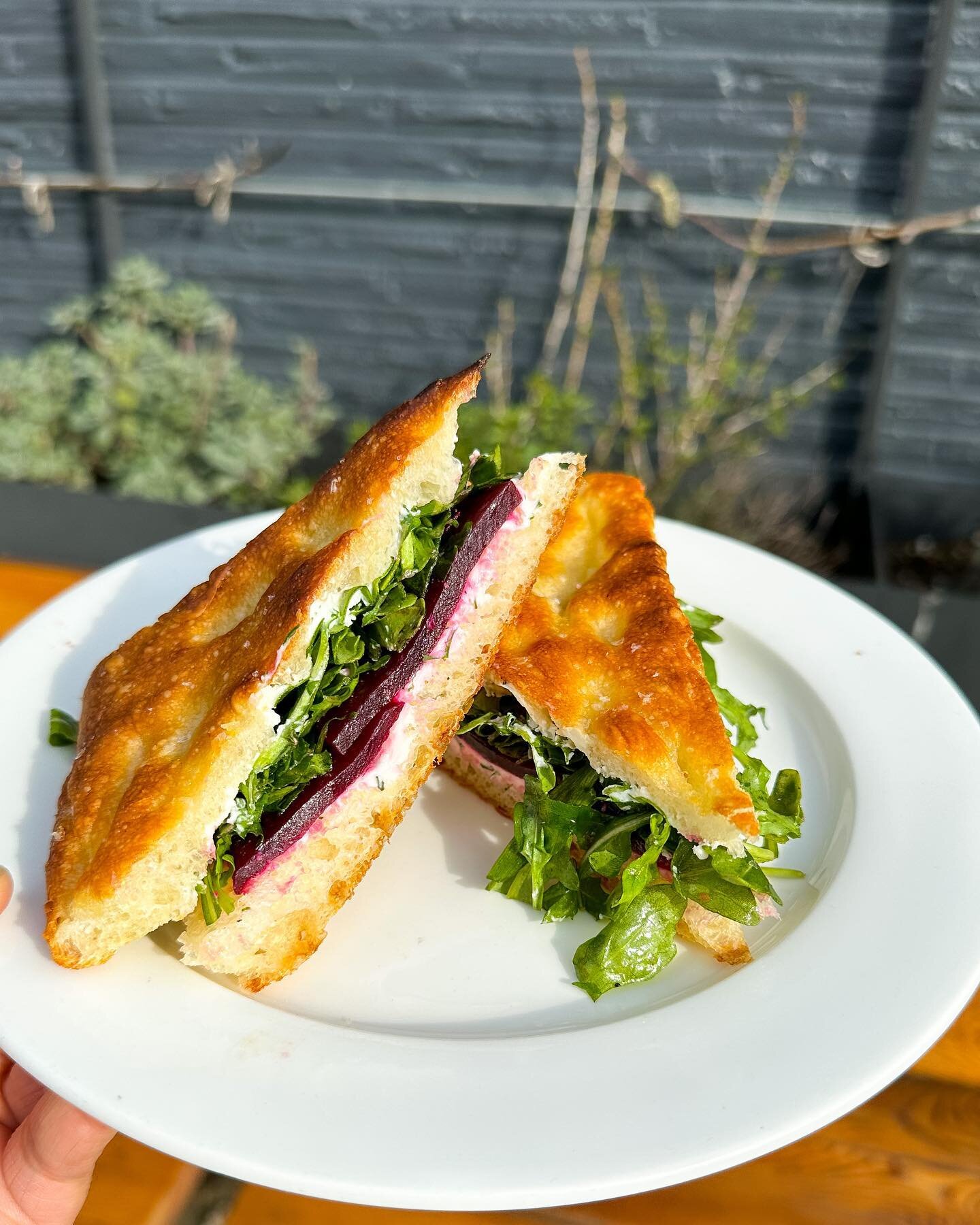 It&rsquo;s new veggie sandwich day! The star of the show here is confit BEETS; slow-cooked in olive oil with spices and citrus. These delicious beets are accompanied by a ricotta-goat cheese spread, arugula, &amp; preserved lemon vinaigrette -- all o