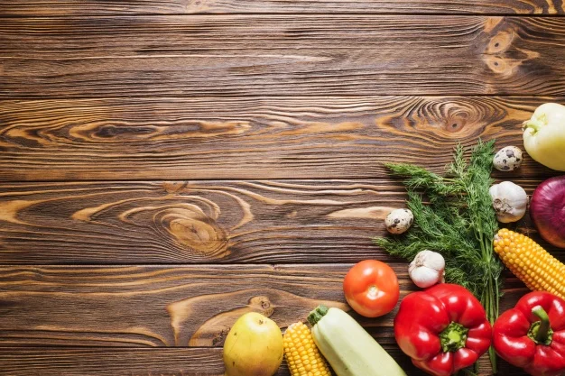 wooden-table-with-vegetables-on-right_23-2147714792.jpg