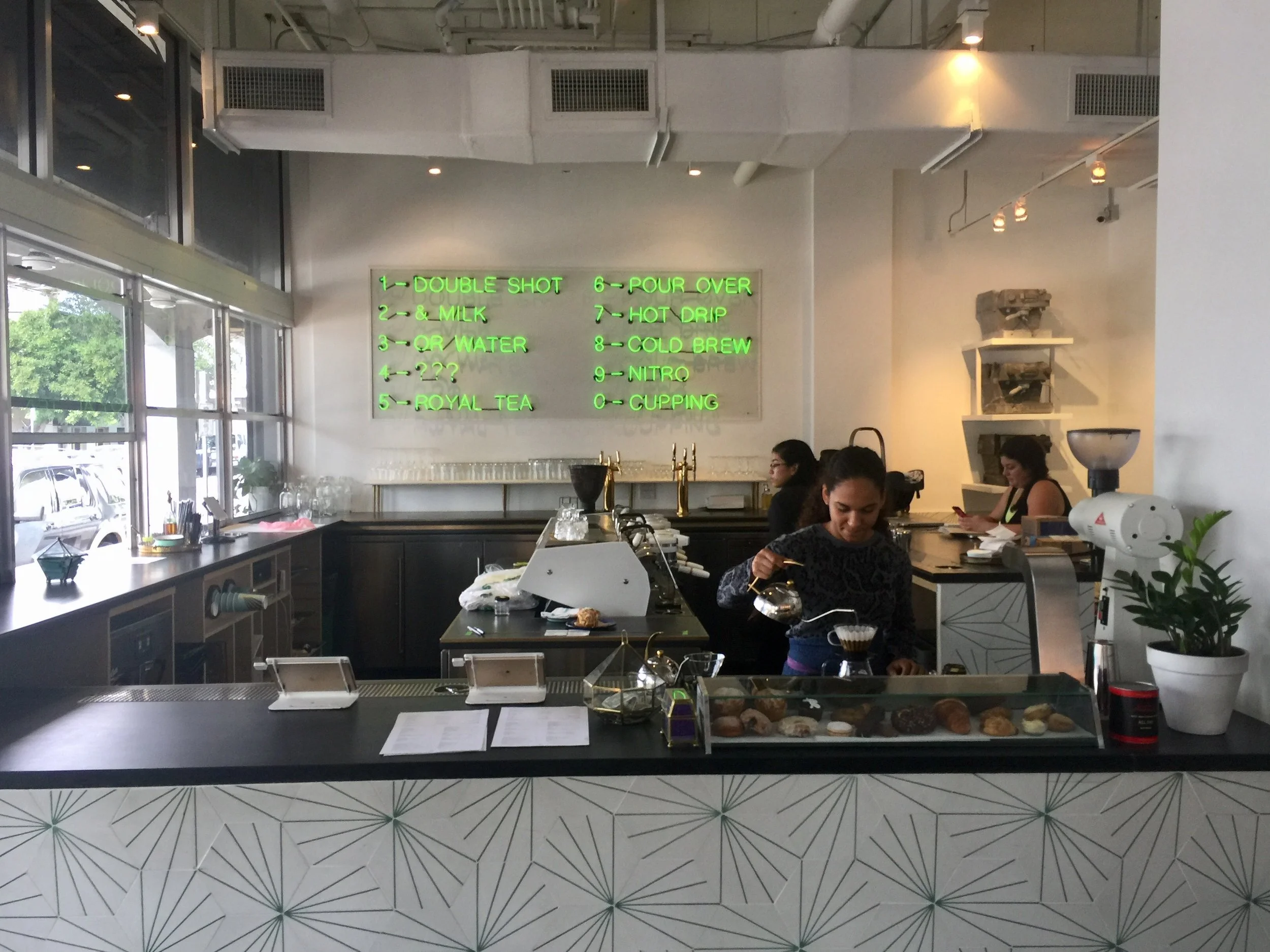 All Day's neon green menu has become a focal point of Miami's burgeoning coffee scene.