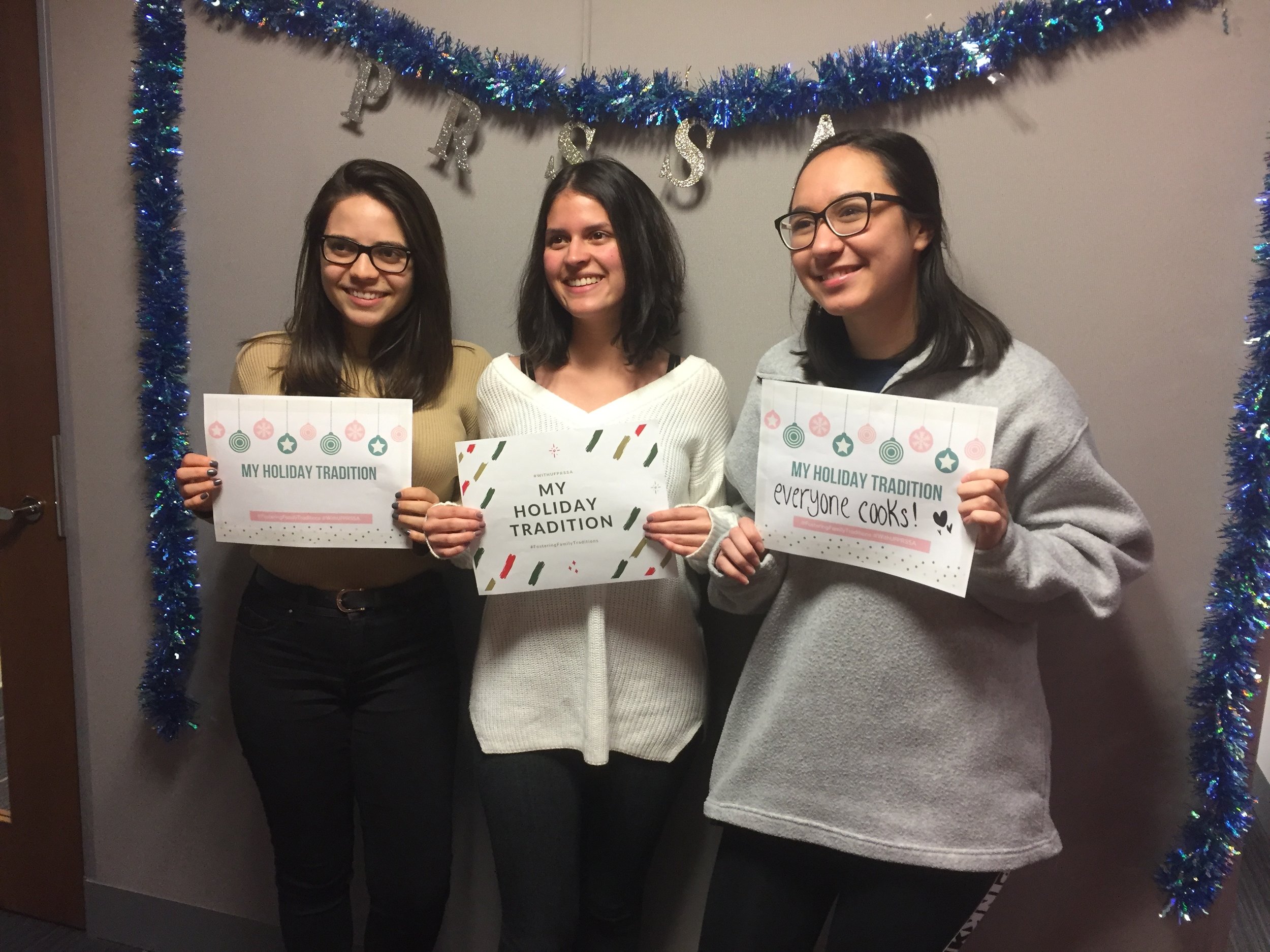 UF PRSSA members Celeste Mahfood, Valentina Pinzon and Christine Skofronick participating in the #FosteringFamilyTraditions campaign at our holiday social event