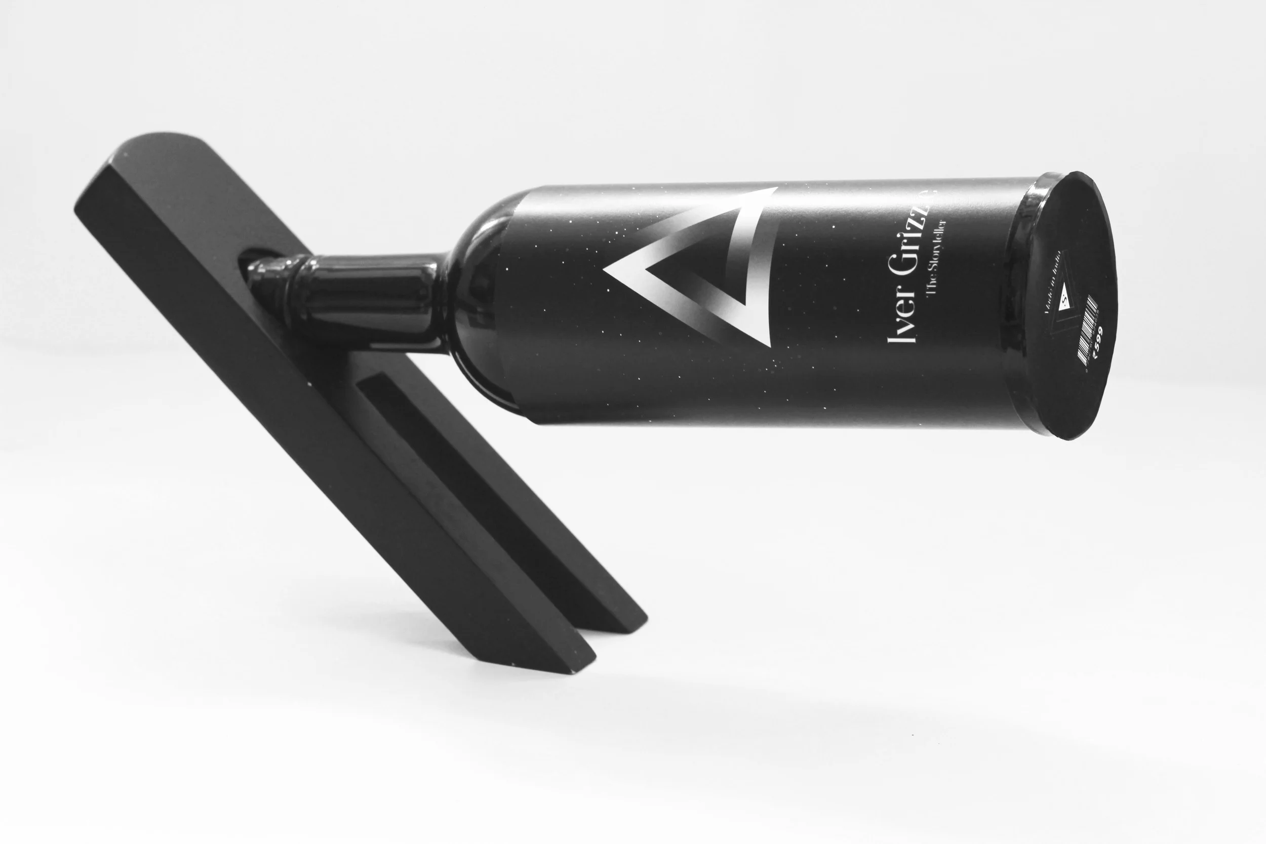 A wine bottle holder used for display, made by Navin Devnani Torres.