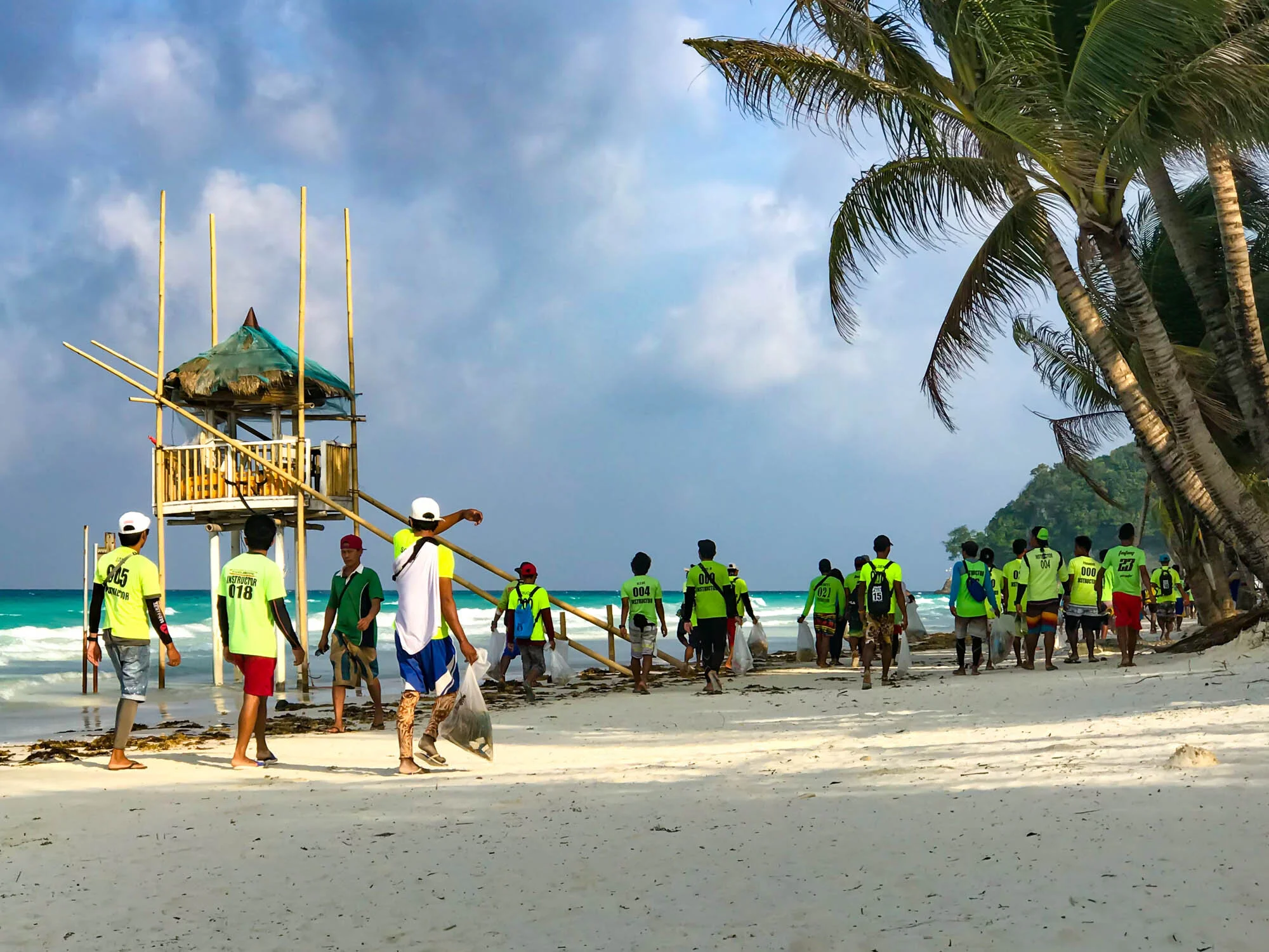 2019, White Beach Station 1. I was having my morning coffee when I saw these instructors on their way to work picking up trash.