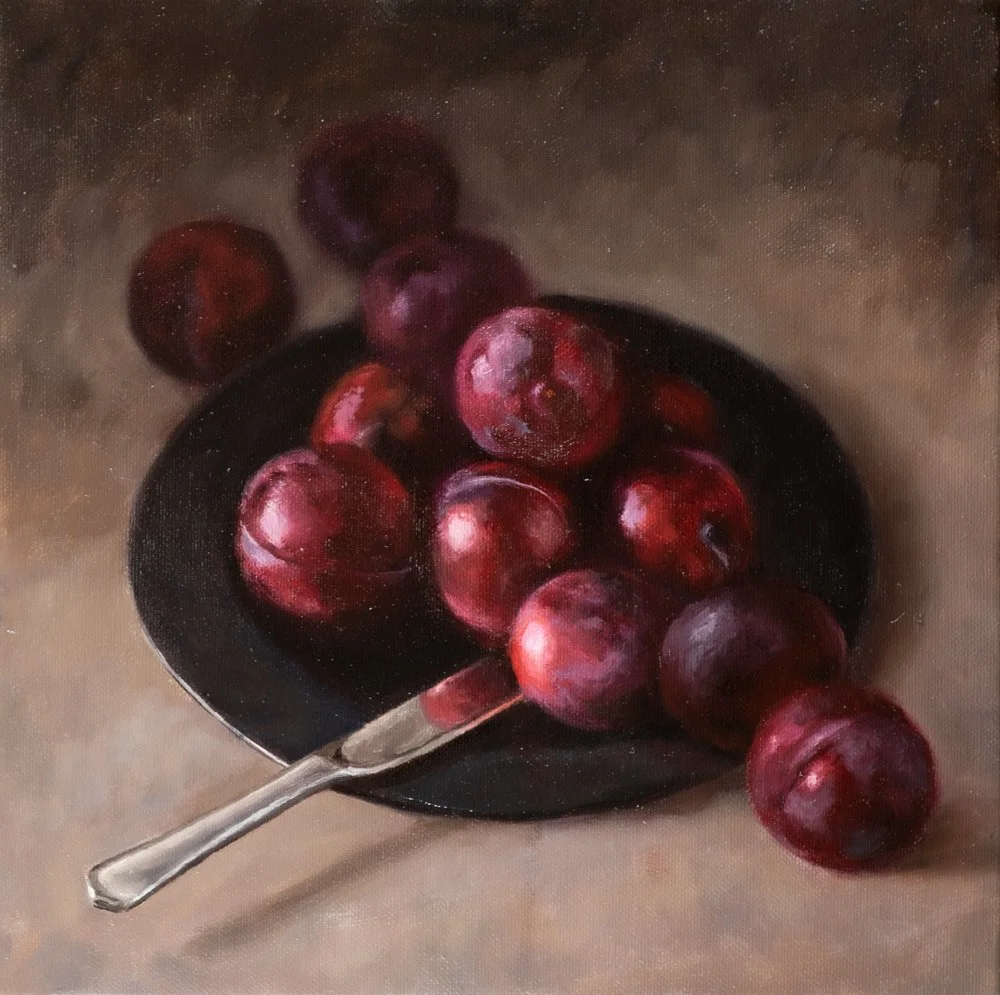PLUMS ON A DARK PLATE