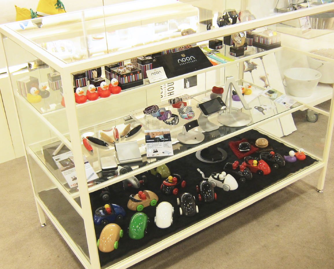 Half-opened glass shelf with different layers, customer can touch the product