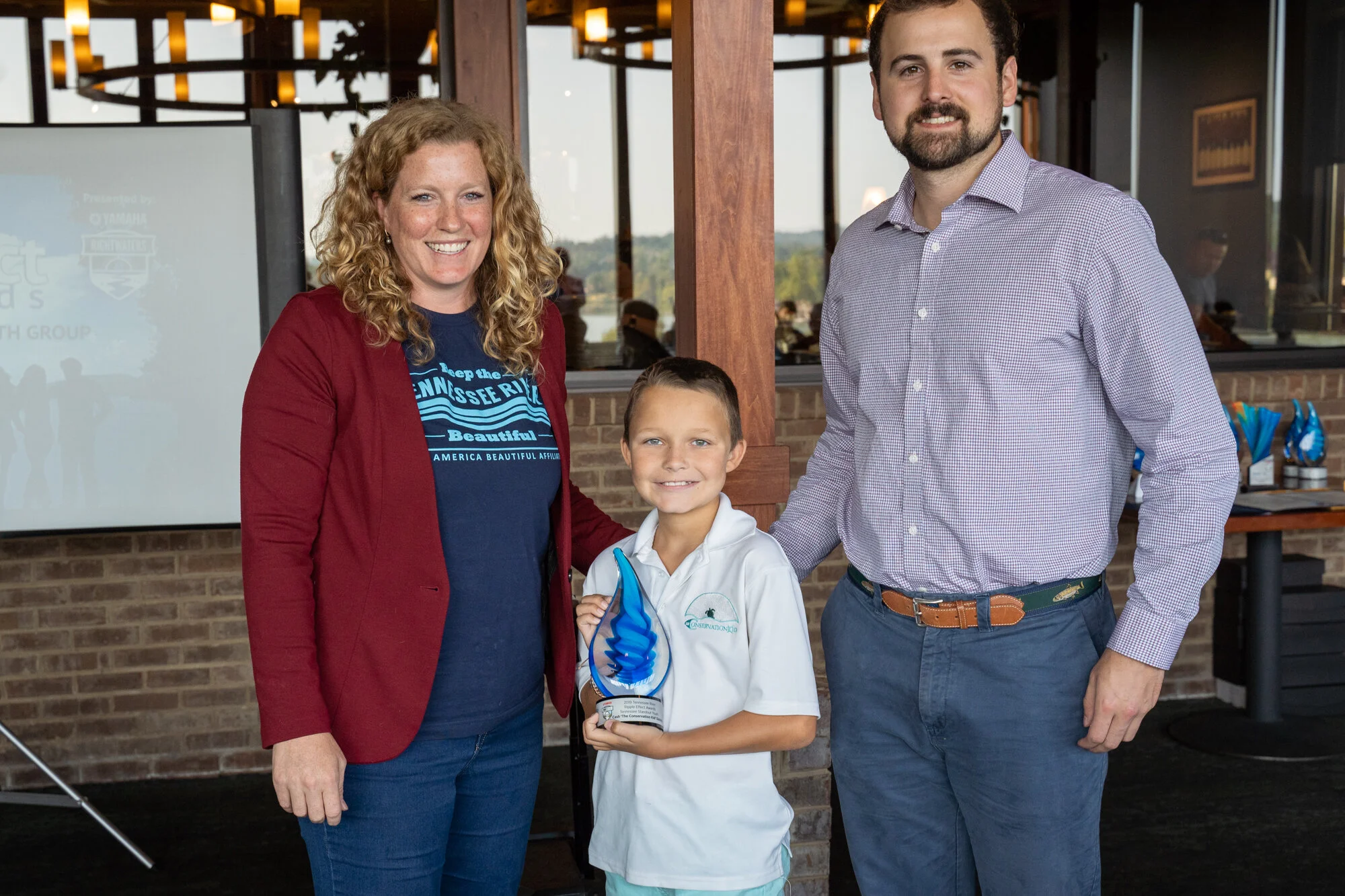 Cash ‘The Conservation Kid’ Daniels accepts his Ripple Effect Award for the Standout Youth category. Also in photo: Kathleen Gibi, KTNRB Executive Director and Kyle Howard, KTNRB Board President.