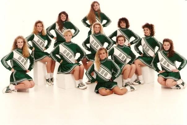 I was also captain of the junior varsity cheer squad the year I decided to chop my hair off. You can see me in my feminist rebellion germinating phase here second from the right.