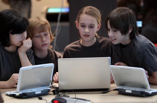 children-try-out-networked-computer-laptops-in-the-digitial-classroom-at-the-microsoft-stand-at-the-cebit-technology-fair-on-march-1-2010.jpg