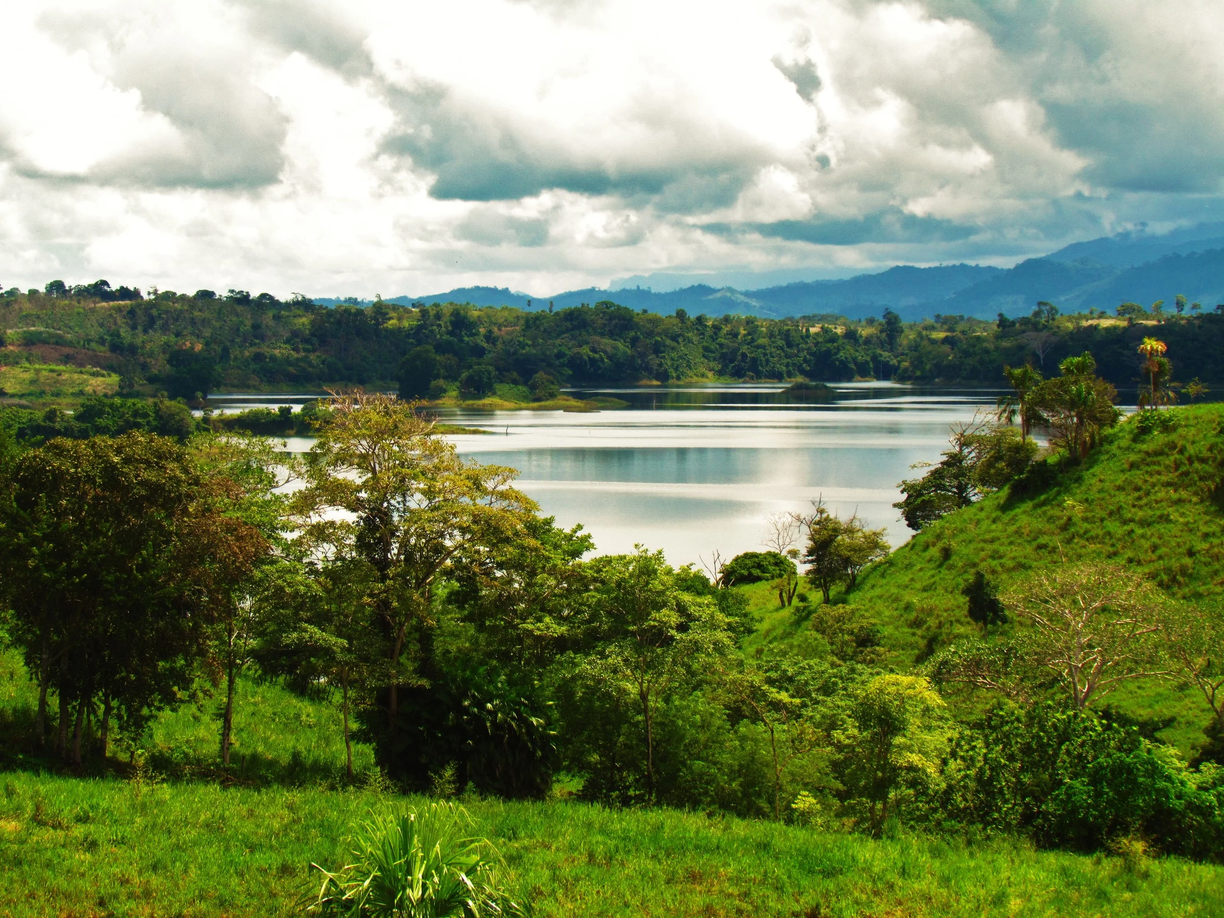  Most of the property is fairly flat or gently sloping toward the Lake. &nbsp;However, from the hills at the back of the property, beautiful views of this portion of the Lake add to the tranquility. &nbsp;The islands that protect  Aguas Mansas  (Calm