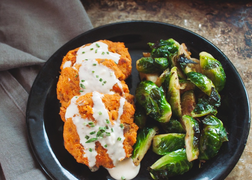 salmon cakes on a black plate.jpeg