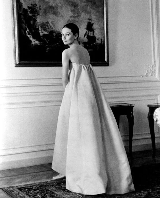 Audrey Hepburn in 1955 in Givenchy. Source unknown.