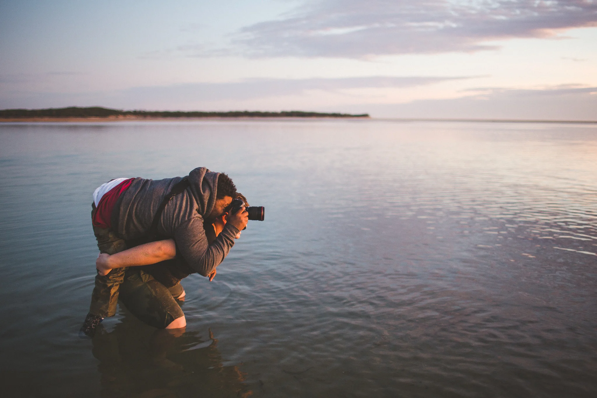Jaleel being carried into the water to get the shot he needed by James Day. Photo by: Josh Mikhaiel