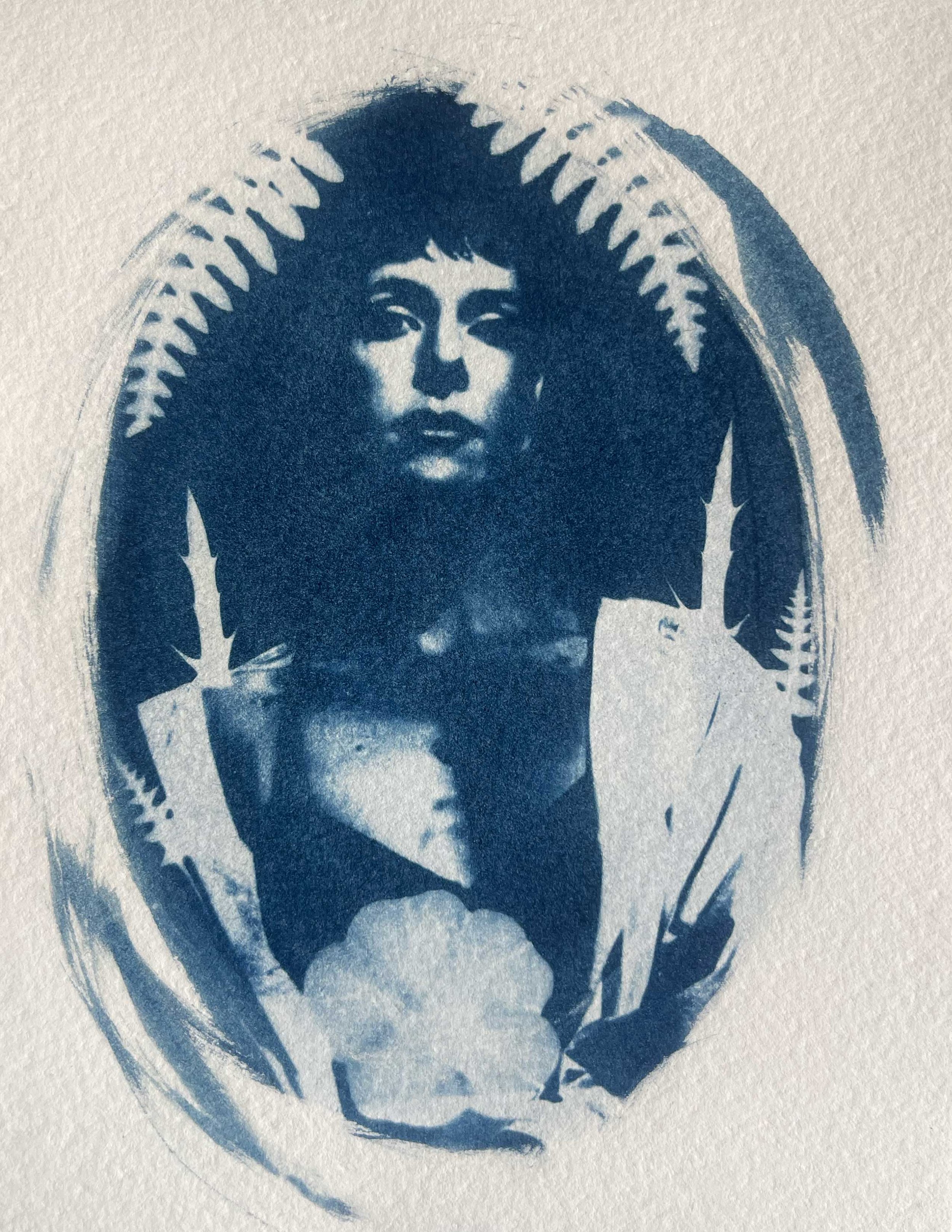 Cyanotype  portrait of a Jesi Jean with dark hair, surrounded by fern leaves, with a cloud at her chest