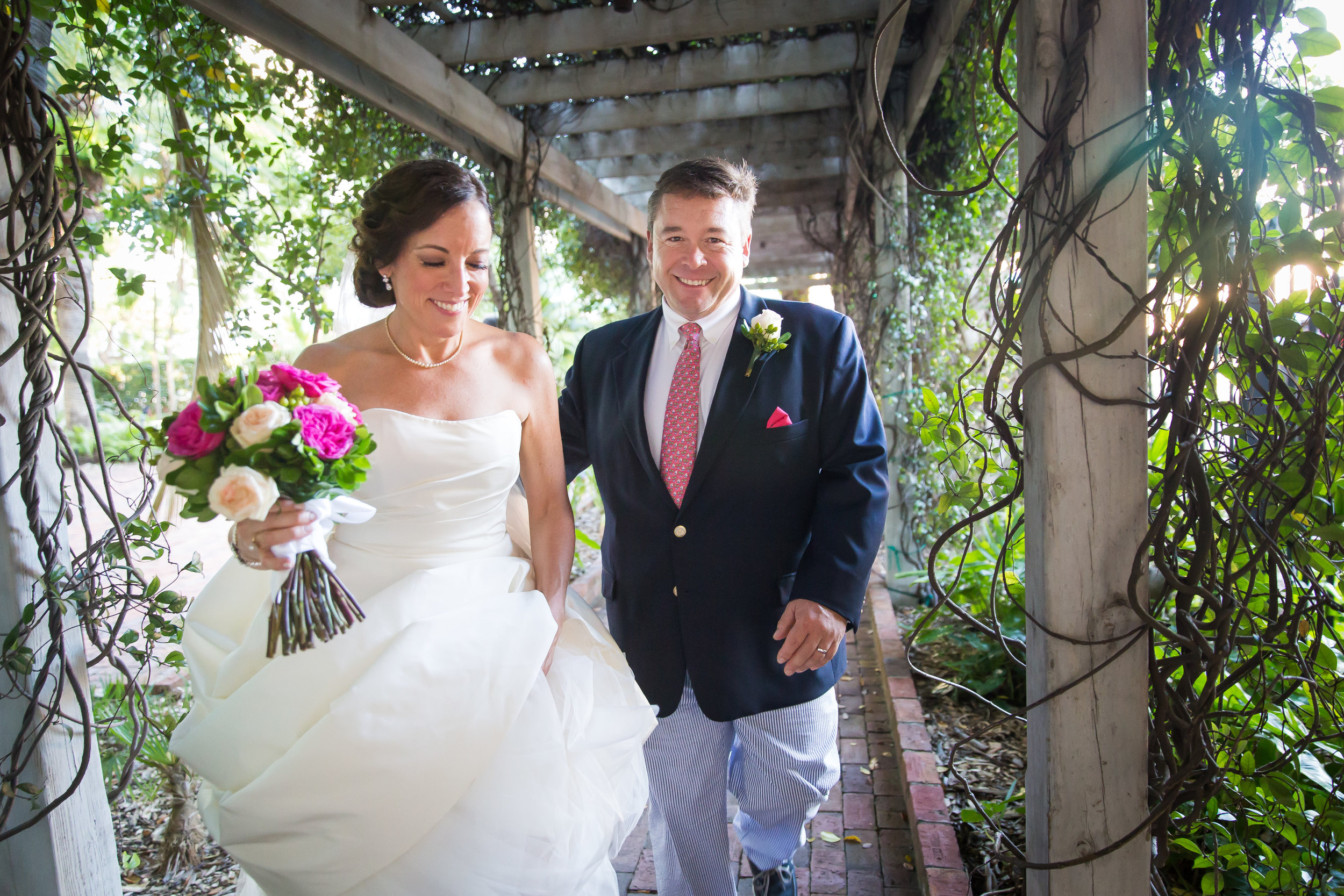 key-west-Bride-and-groom-walk-toward-camera-smiling.jpg