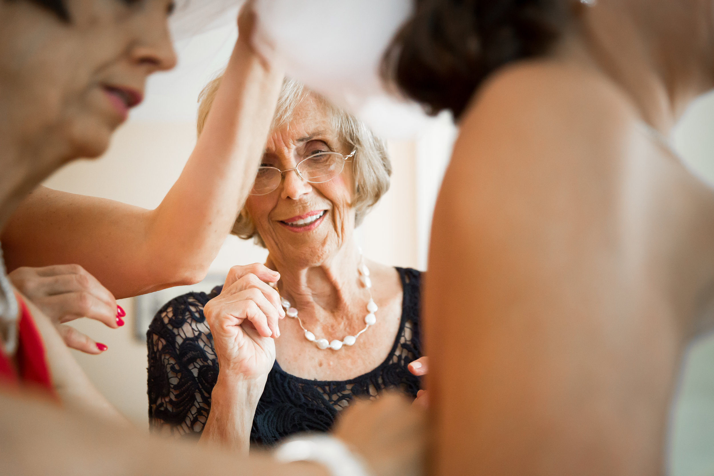 Grandma-watches-bride-getting-ready-at-saint-pauls-cathedral-key-west-by-photographer-karrie-porter.jpg