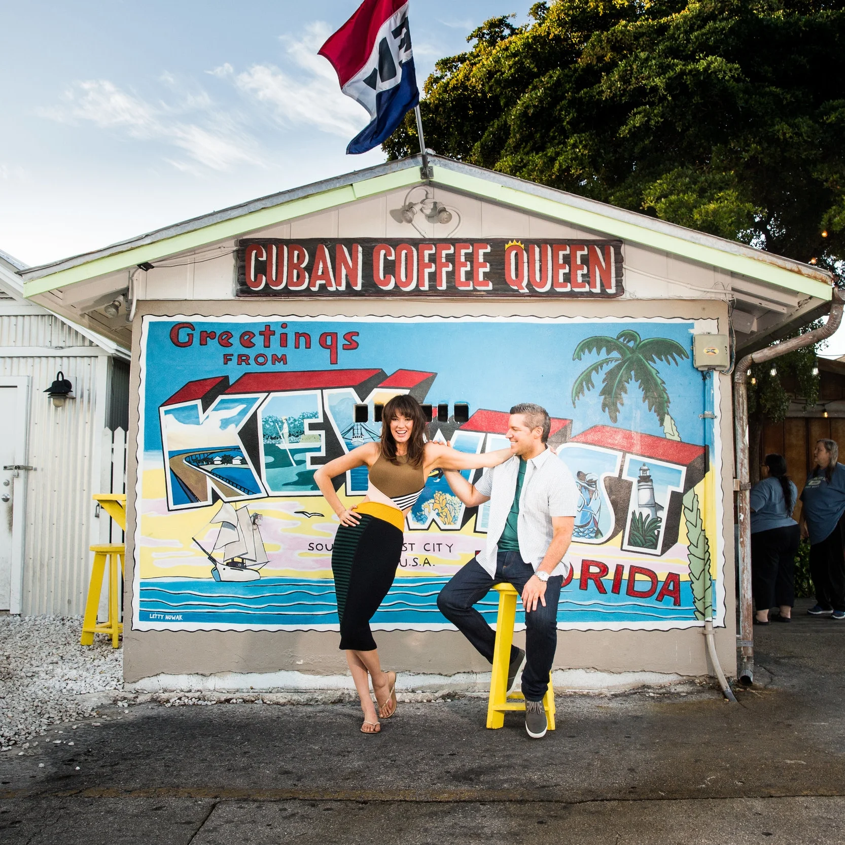 Engagement-Shoot-in-Front-of-Welcome-to-Key-West-Postcard-Mural-at-cuban-coffee-queen.jpg