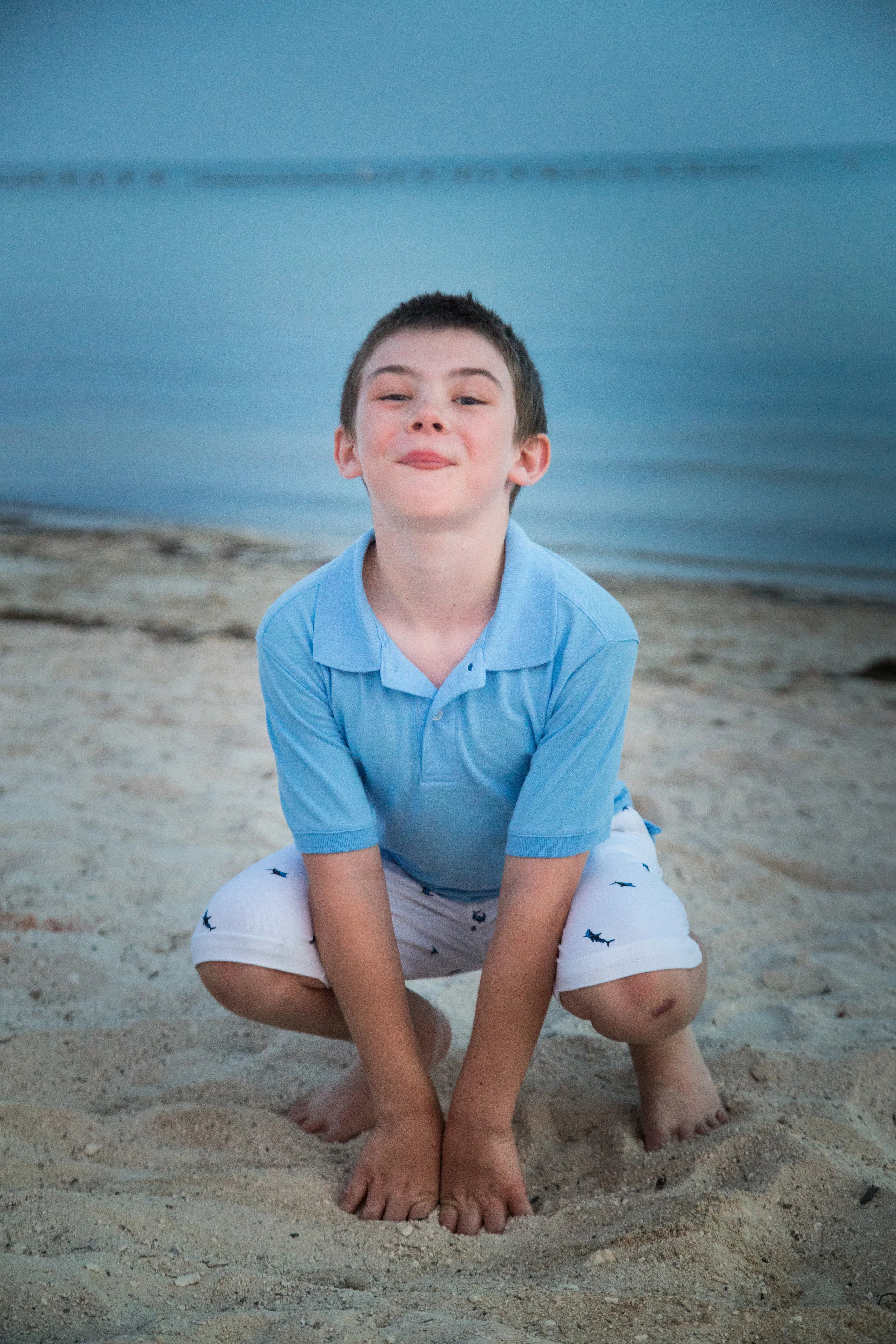 Cute-Kid-in-frog-pose-on-beach.jpg