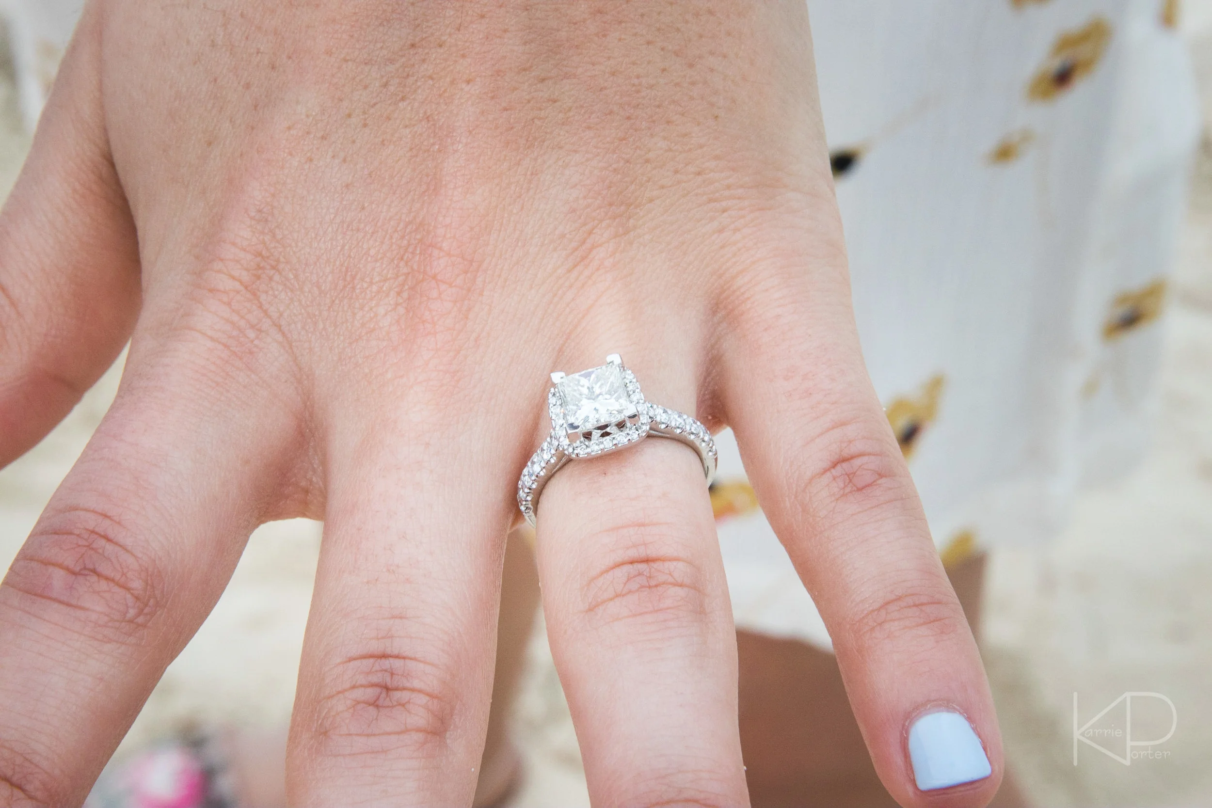 Couple gets engaged during undercover proposal photo shoot on Sunset Key private island at Crescent Beach off the coast of Key West Florida