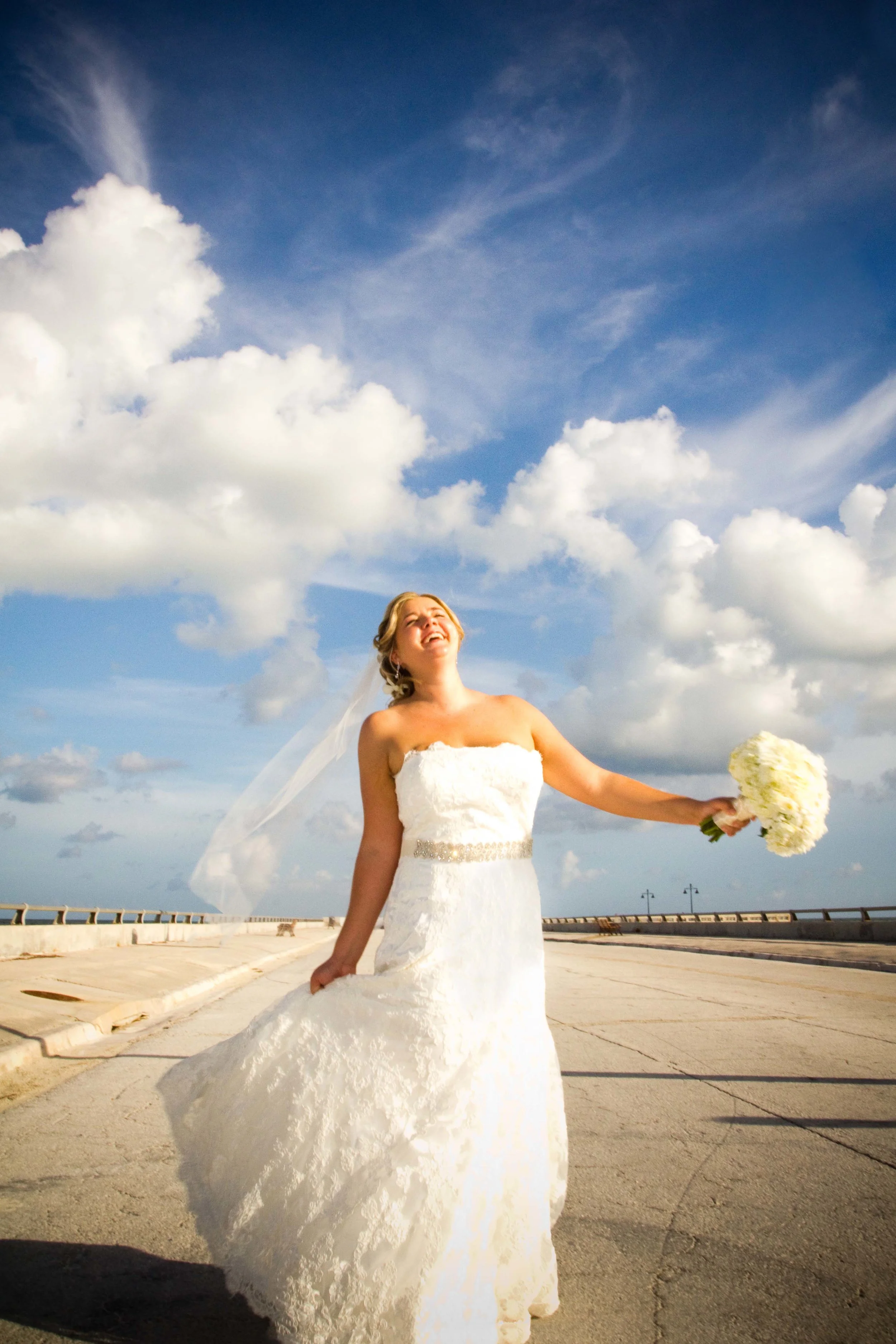 Unscripted images like this cannot be “posed”. A bride who is not familiar being in front of the camera will need time to warm up to the idea of playing and laughing, not worrying about what’s going on around her. Give yourself time to breathe and play on the wedding day.
