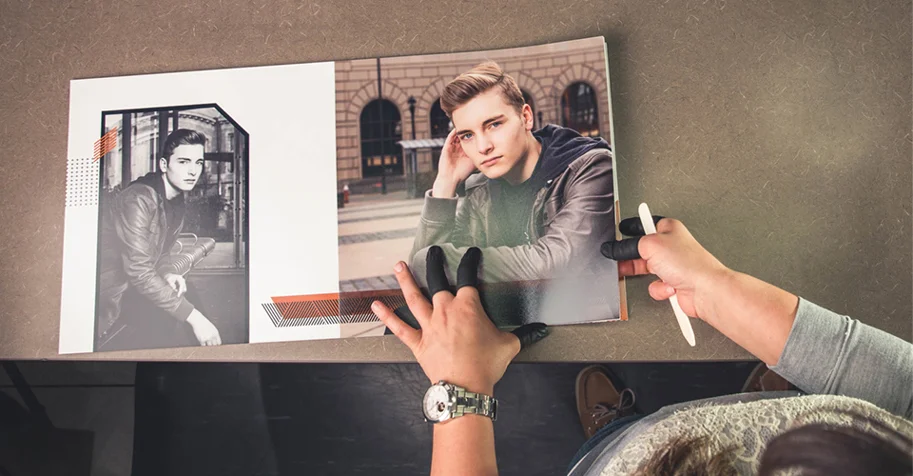 A professional lab technician checking the pages for correct color and sizing