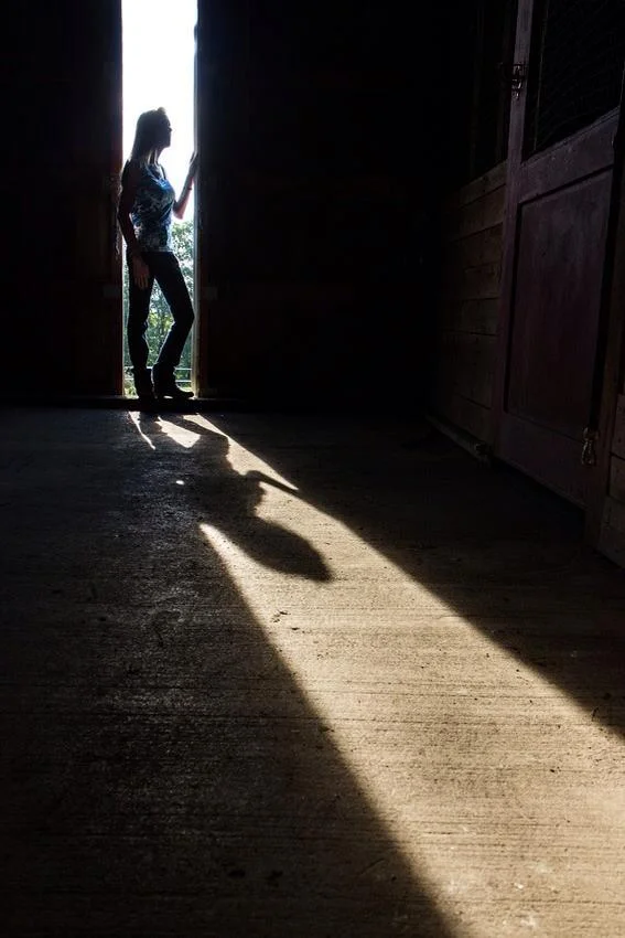 Mom in barn window.jpg