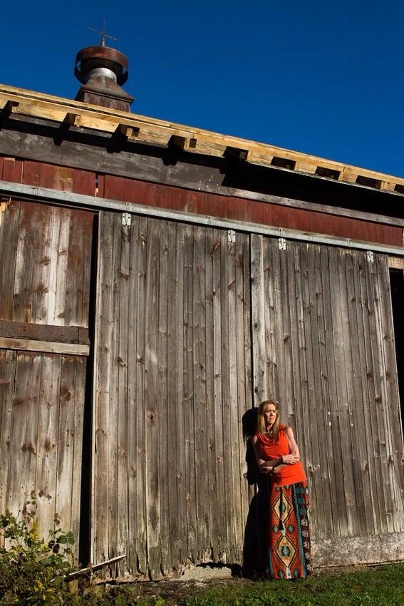 Mom next to barn wall.jpg