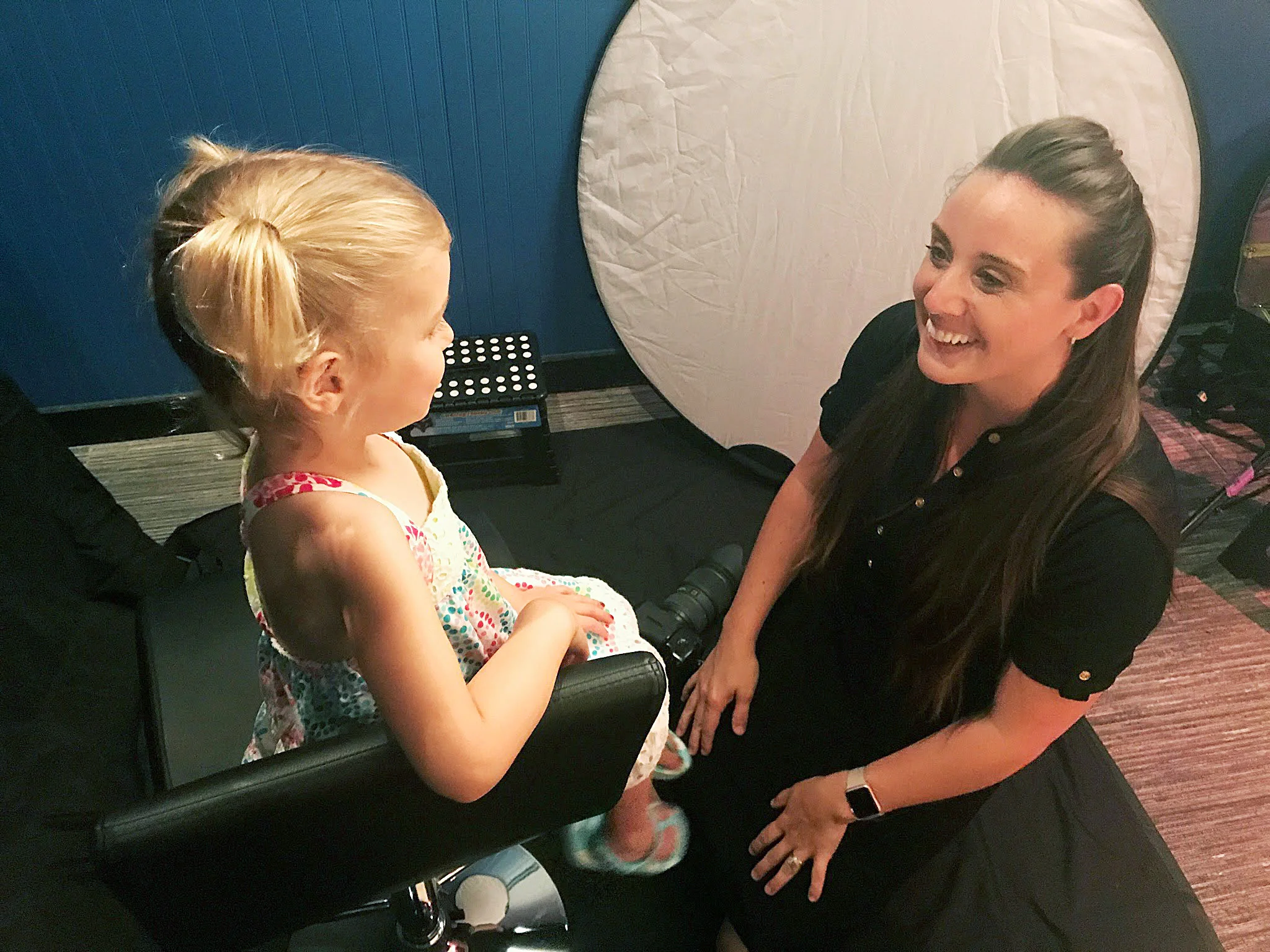 Karrie interacting with child during portrait session.jpg
