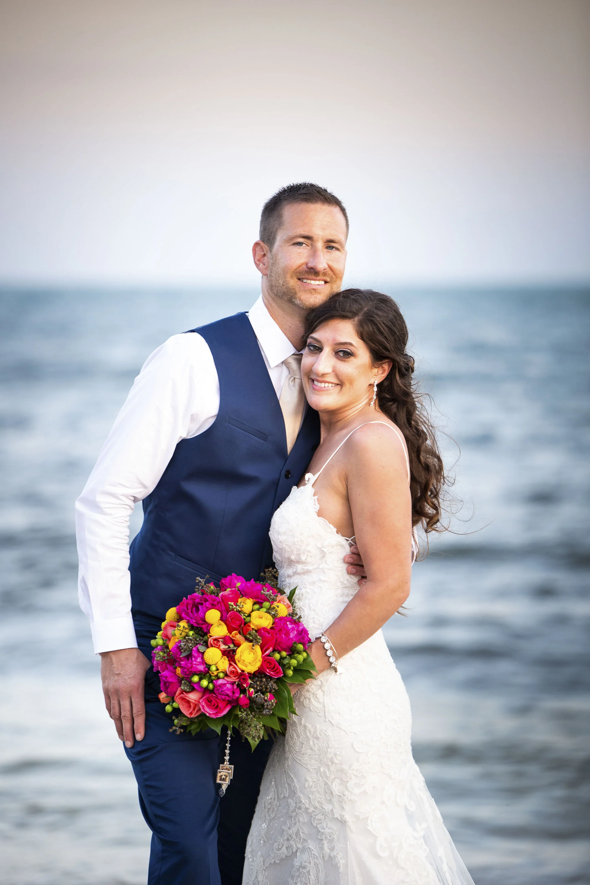 Bride and groom smiling on the beach of Key West