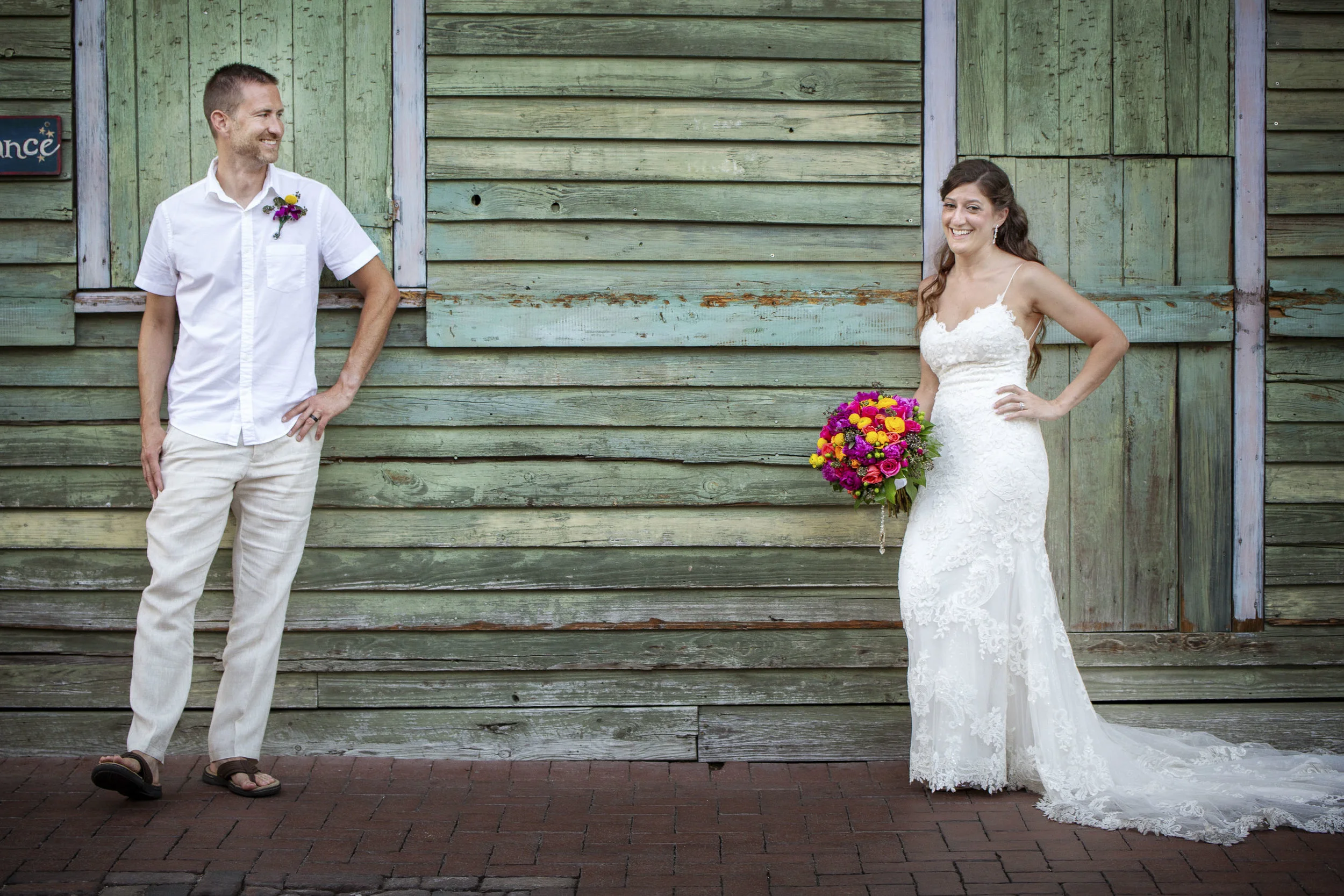 Bride and groom laughing as they take pictures in Key West