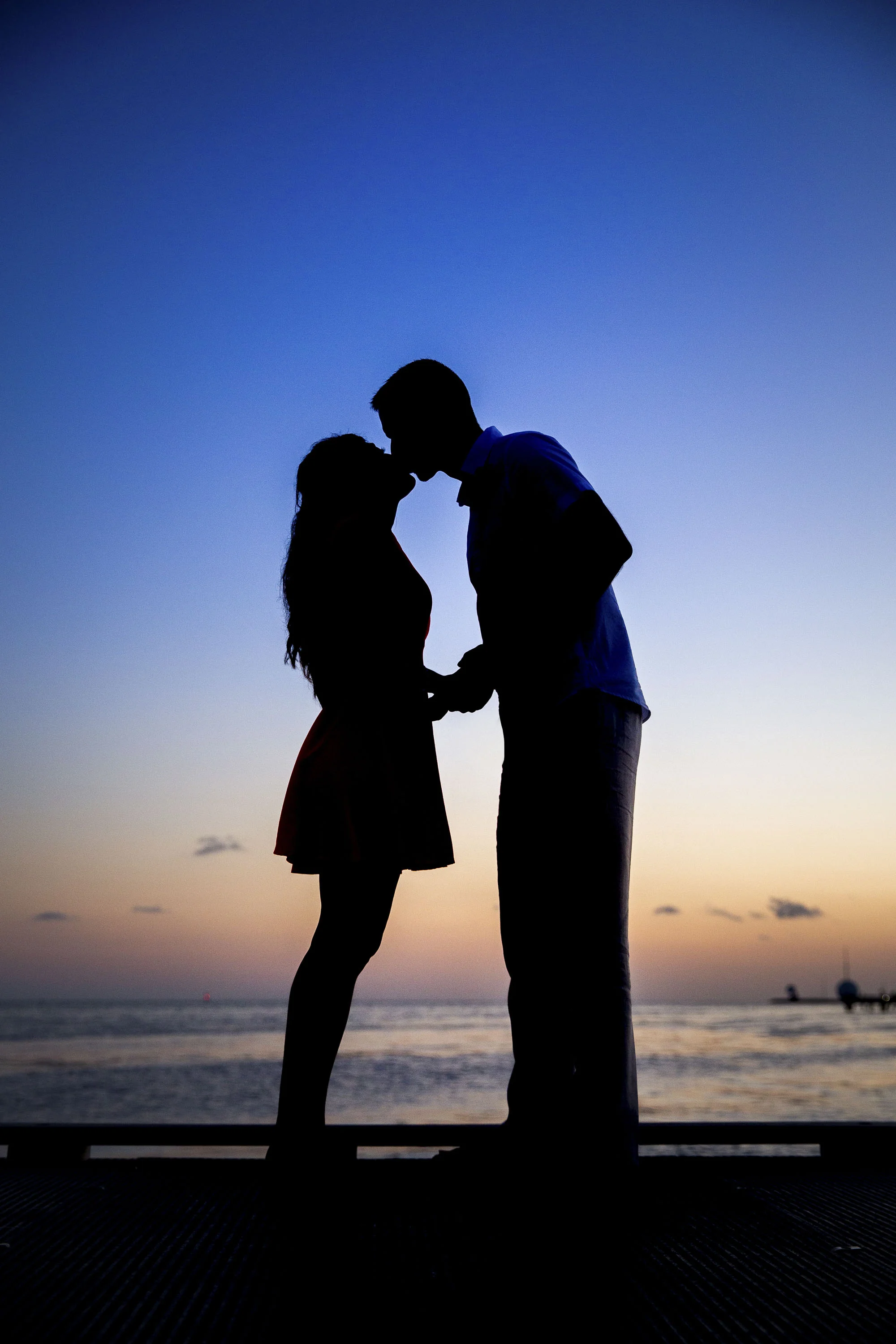Silhouette of bride and groom on the dock in Key West
