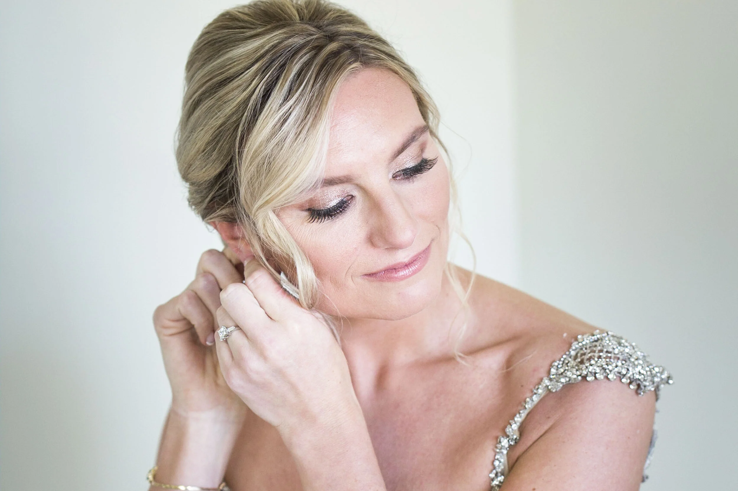 Bride-putting-on-earrings.jpg
