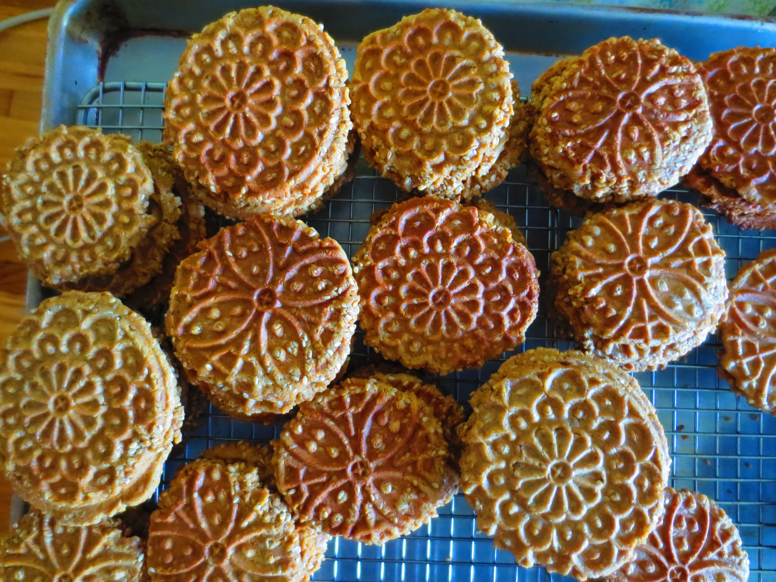 Pizzelle cookies are a traditional Italian flat waffle cookie, whose name means "round, small, flat" deriving from the same root from which we get the word "pizza". If you happen to own a pizzelle iron, it's easy to make gluten-free variations. Pizzelles are a holiday favorite in my family and for the past several years I've secretly been making the cookies gluten-free. The switch is so seamless that no one noticed the change. Sorghum flour alone works well or use a blend (see recipe below). The classic recipe is made with bountiful anise seeds (I use many more anise seeds than the average recipe) and a good shot of vanilla extract. Lately, I've been making sesame pizzelles and then making a sandwich cookies with two sesame pizzelles filled with a raw sesame caramel. The chocolate version is equally addictive and is great paired with hazelnut butter. Pizzelles last well stored in an airtight container and are easy to transport making them perfect for picnics and summer car trips. Gluten-free Sorghum Flour Blend: I like to use this blend where I would use whole wheat flour. It has a hearty slightly nutty taste. In a medium bowl, combine: 2 C sorghum flour 2/3 C potato flour 1/4 C +2 tsp tapioca flour 1 tsp xanthan gum Whisk flours together until well combined. Store in an airtight container until use. Gluten-free Anise Pizzelles: 1/2 C butter, melted (or coconut oil) 3/4 C coconut sugar 3 eggs 1 T vanilla extract 2 C gluten free flour mix (see recipe above) 1/2 tsp salt 1/2 C anise seeds Gluten-free Chocolate Pizzelles: 1/2 C butter, melted (or coconut oil) 3/4 C coconut sugar 3 eggs 1 T vanilla extract 13/4 C gluten free flour mix (see recipe above) 1/2 tsp salt 1/2 C cocoa powder