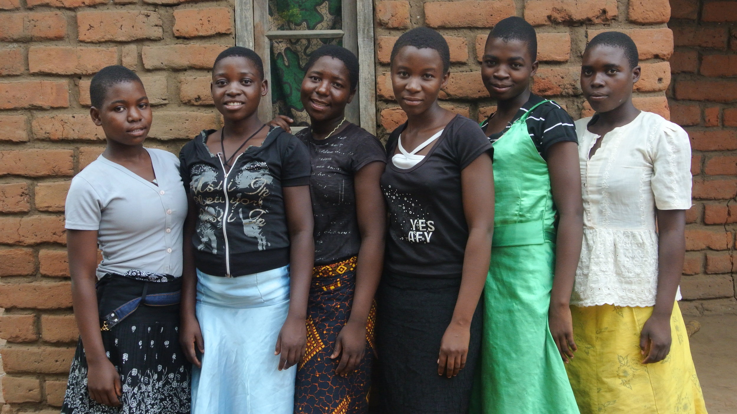 A group of young women who participate in the Women's Empowerment Program