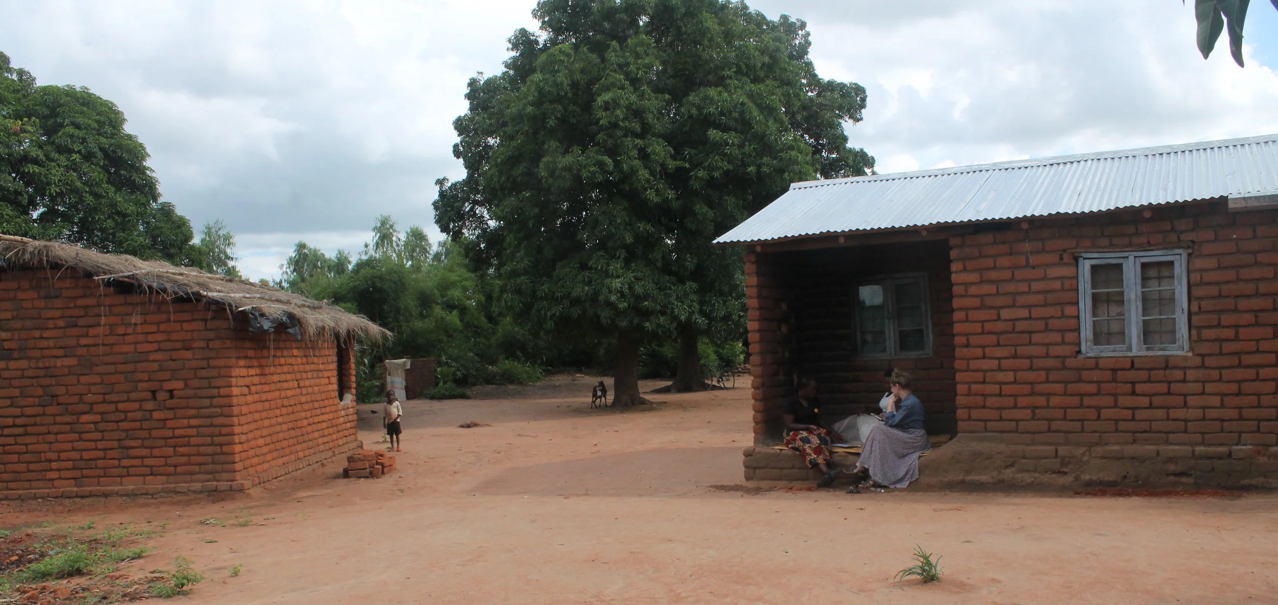 Memory sitting on her grandmother's front porch, talking with Story Time team members.